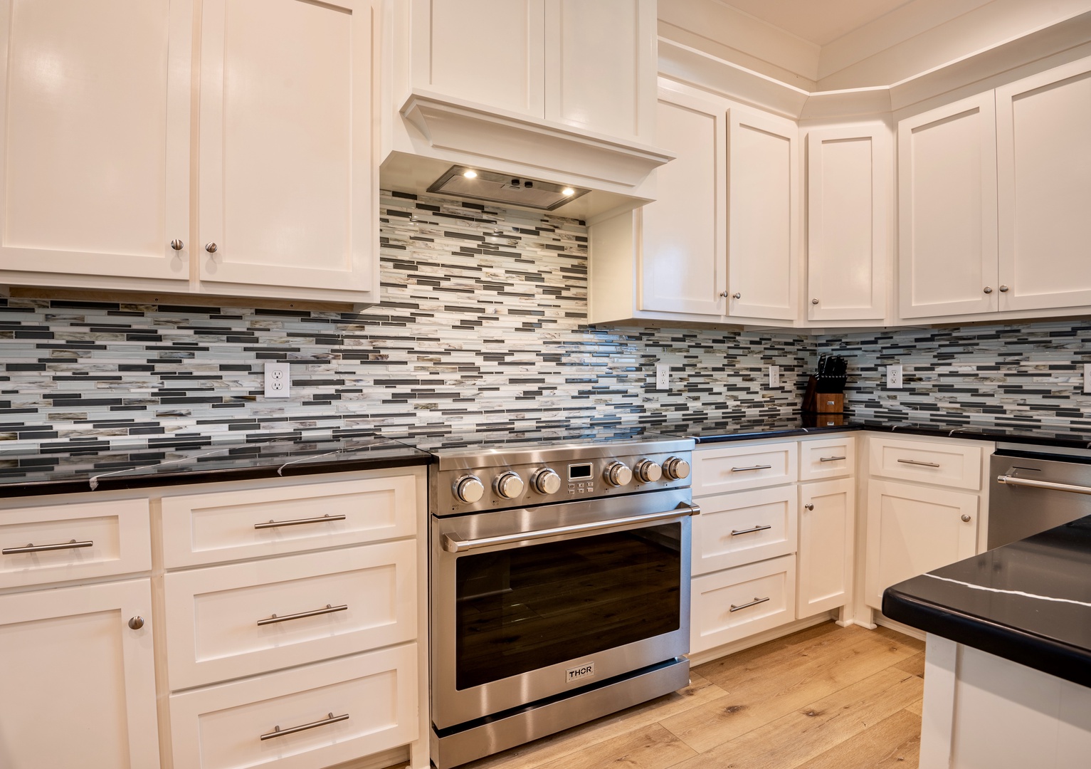 Kitchen boasts dual islands, fully equipped
