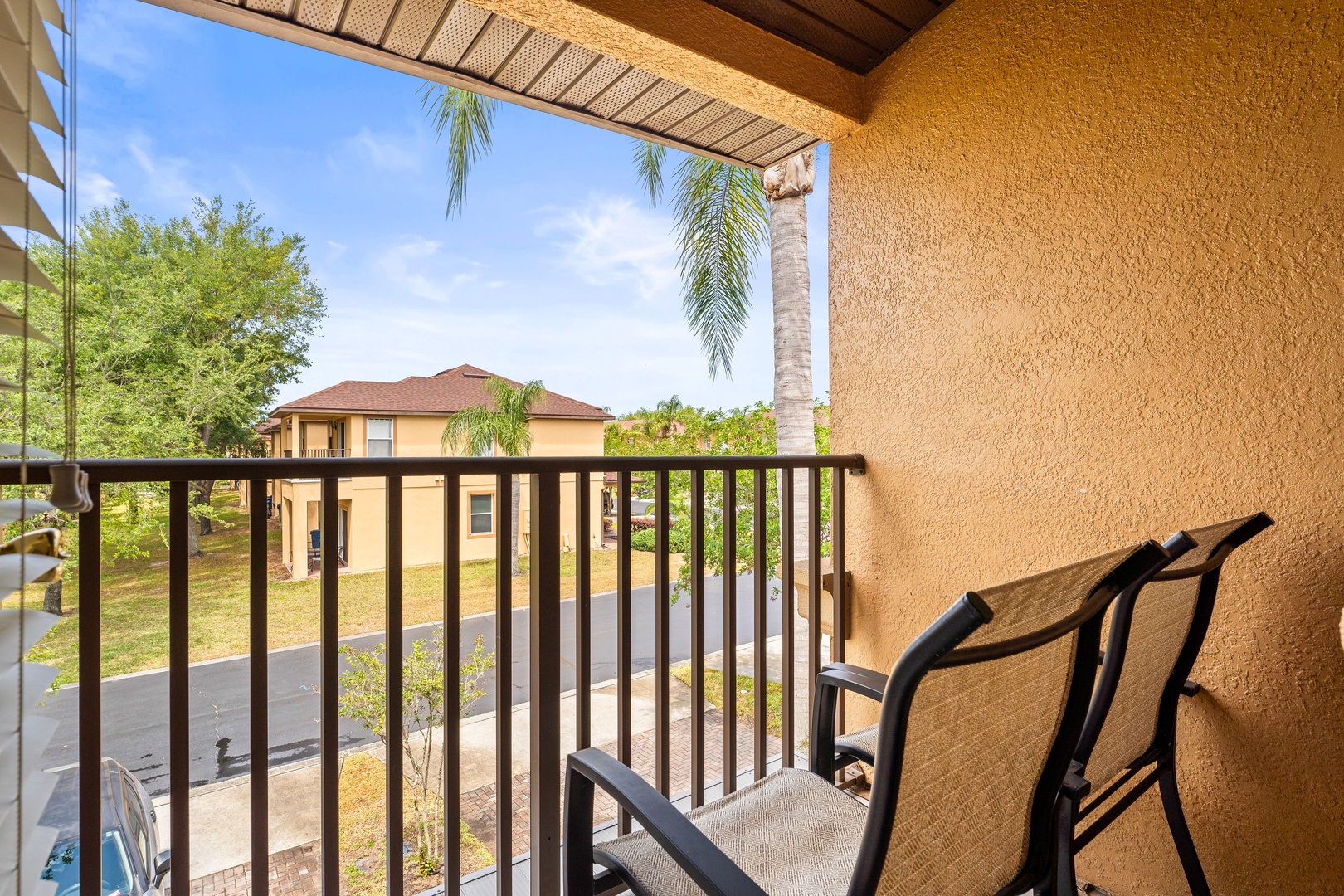 Balcony with comfortable seating and peaceful garden views