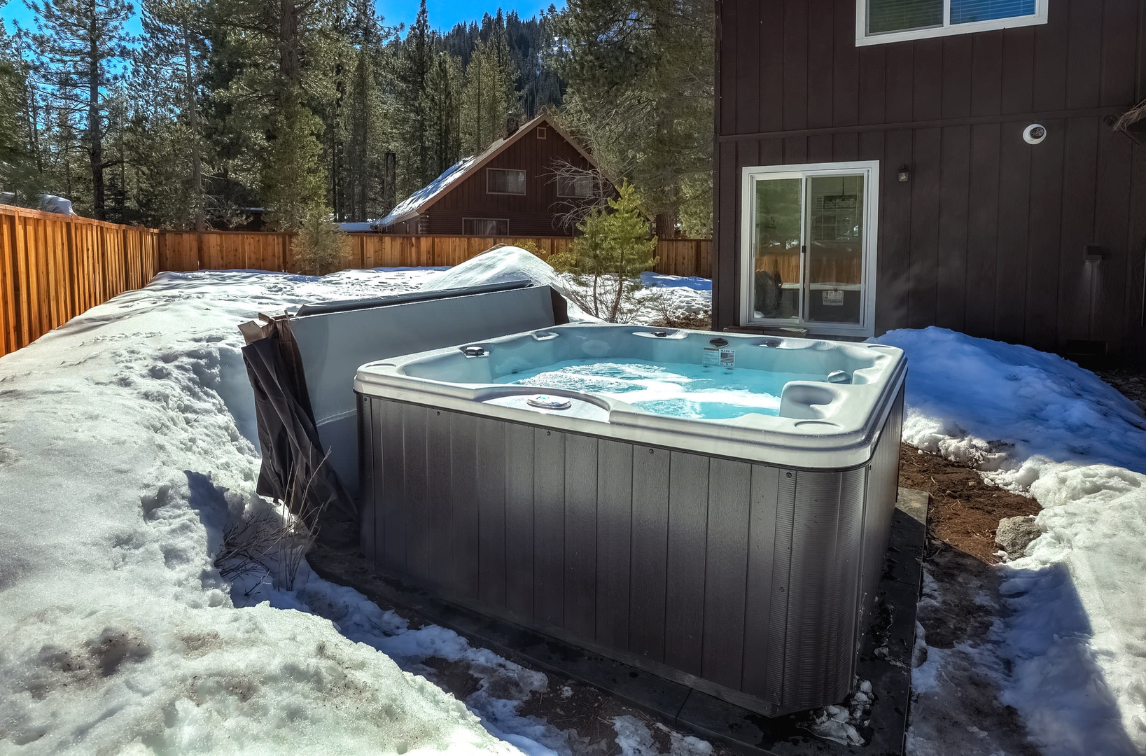 Private outdoor hot tub in backyard