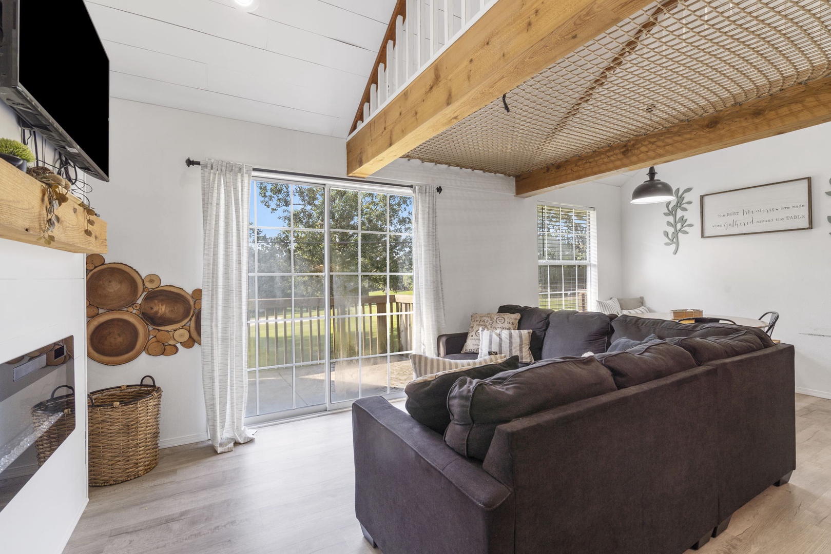 Floor-to-ceiling sliding glass doors in the living area