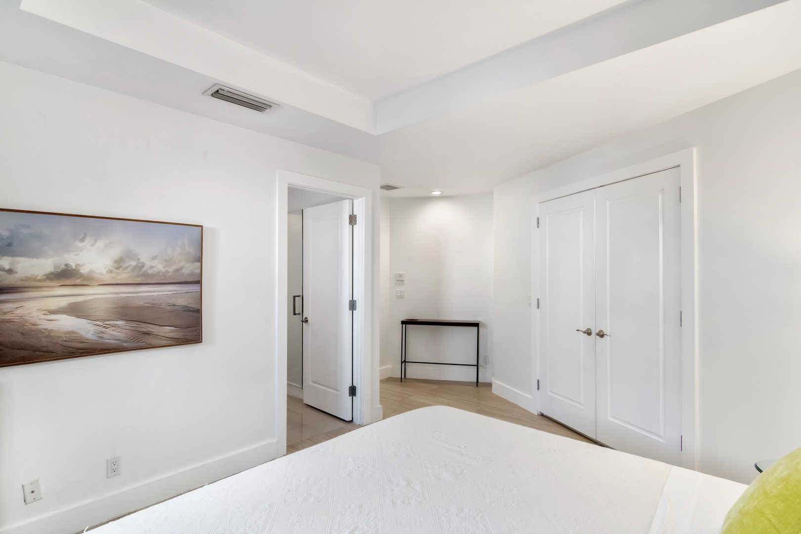 This polished 1st-floor queen suite includes a private ensuite & patio access
