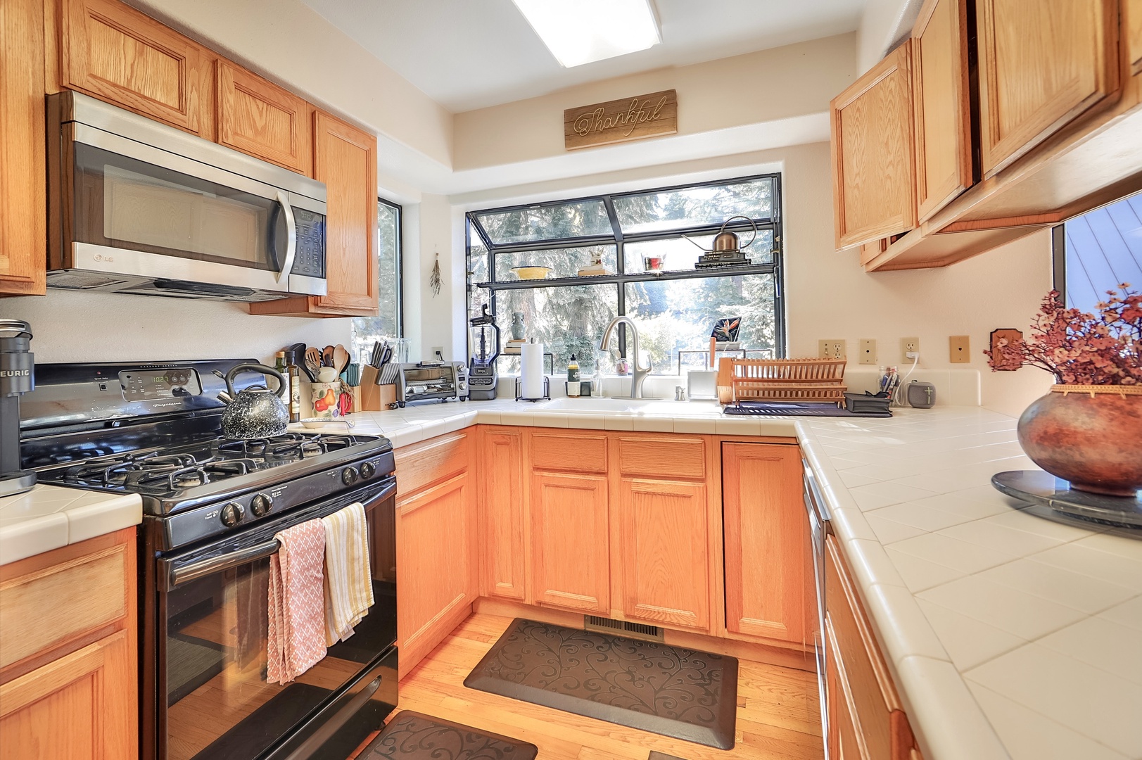 The open, airy kitchen offers ample space & all the comforts of home