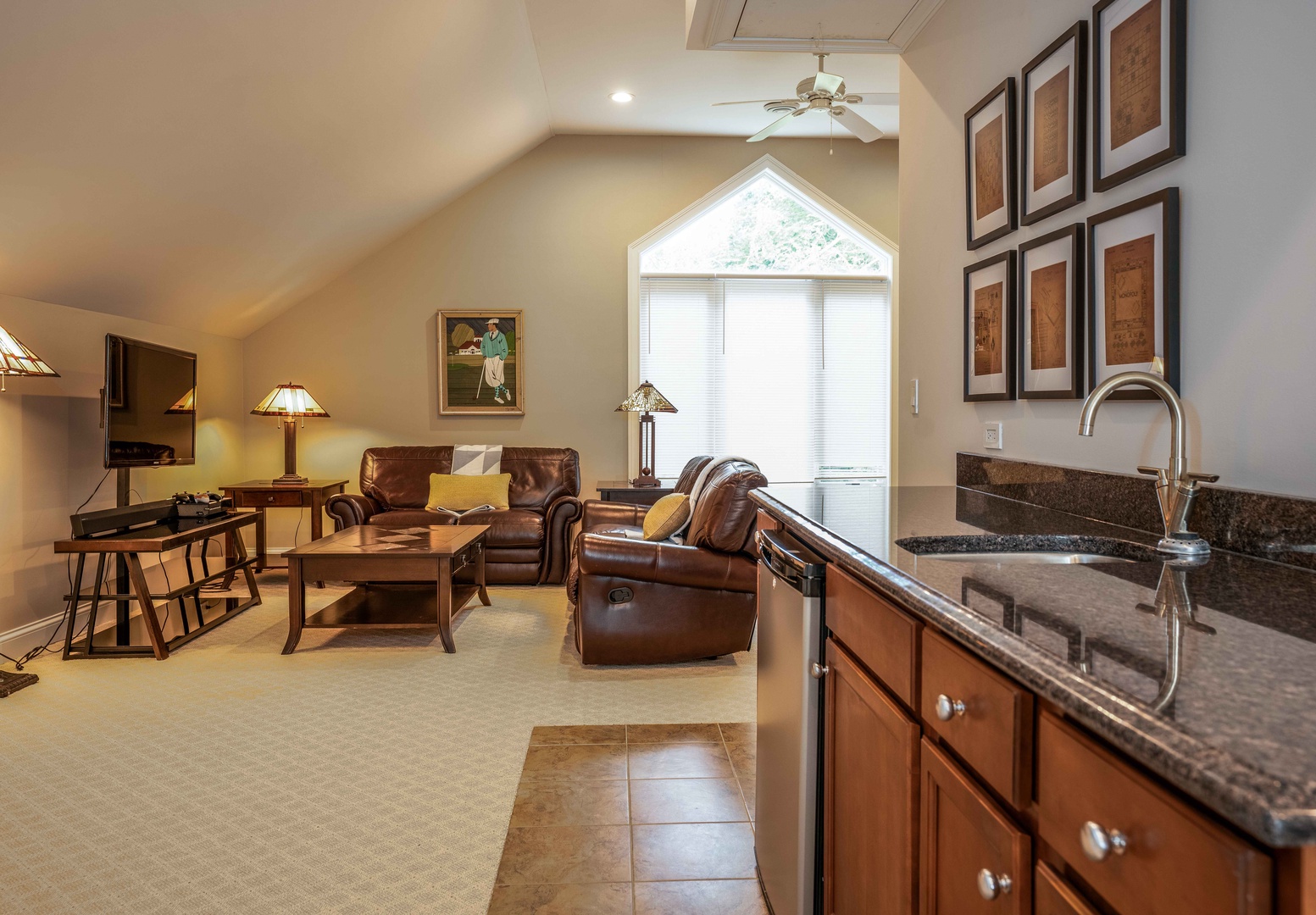 Game room with sitting area, Smart TV, wet bar, pool table, and poker table