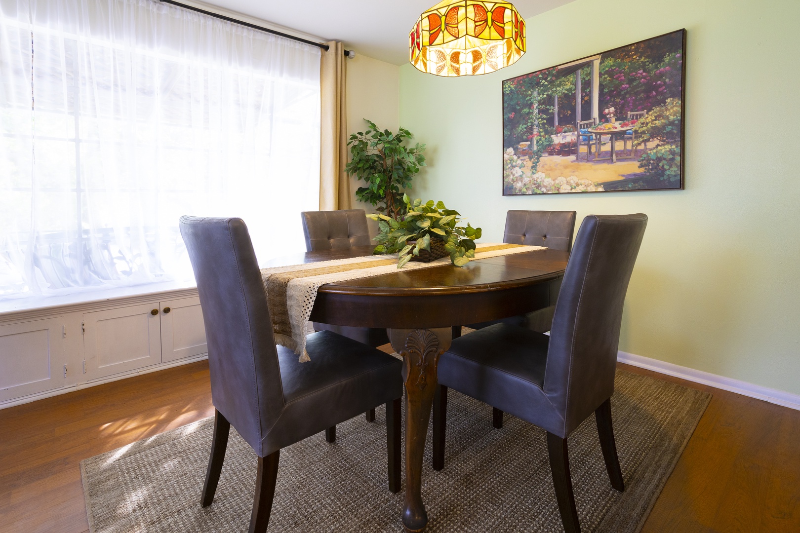 Gather for elegant meals together at the dining table, seating 4