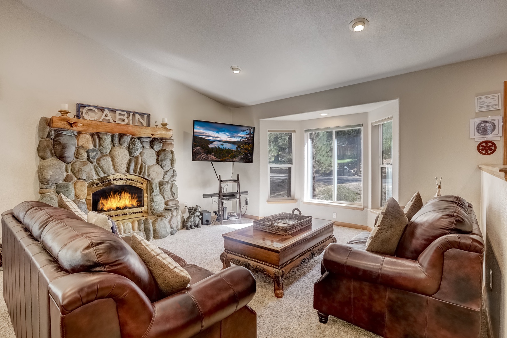 Living room with Smart TV, gas fireplace, and comfortable seating