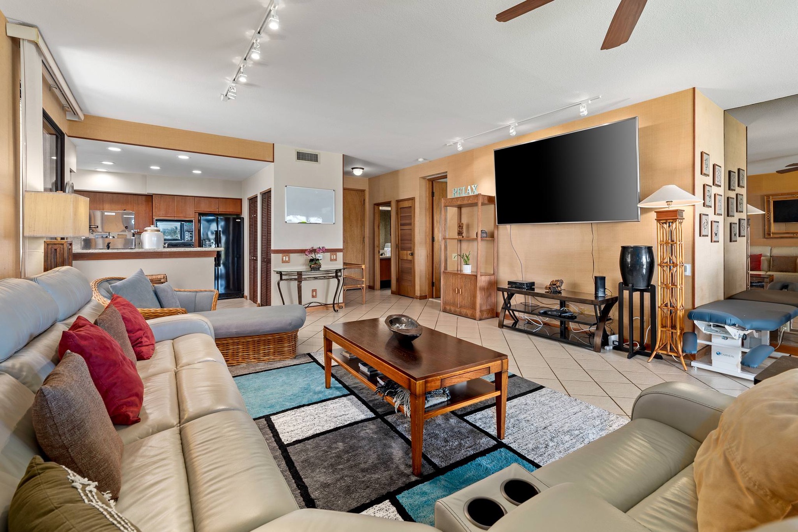 Living room with 86" flat-screen TV and comfortable seating