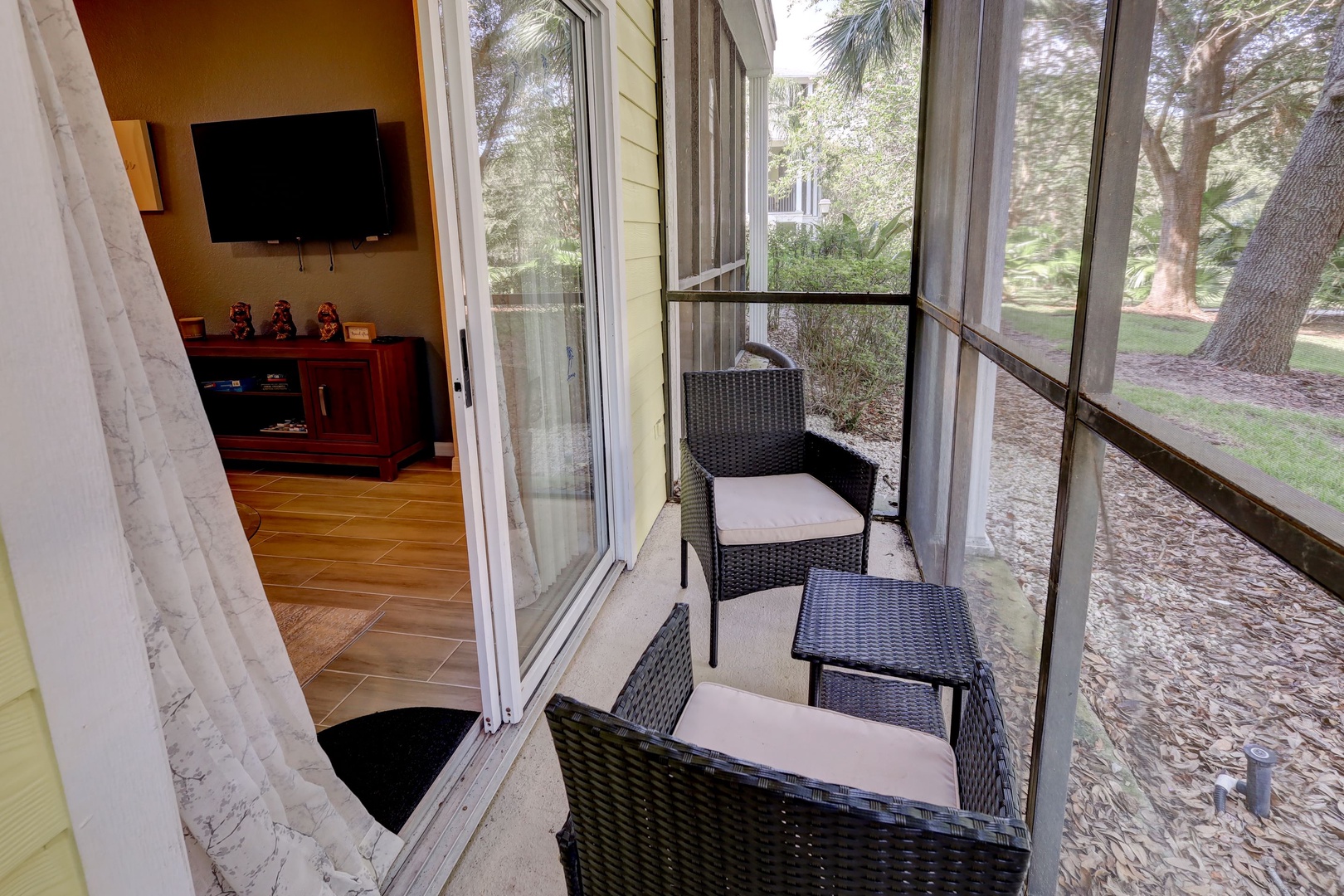 Lounge the day away on the screened-in porch, offering views of the pool