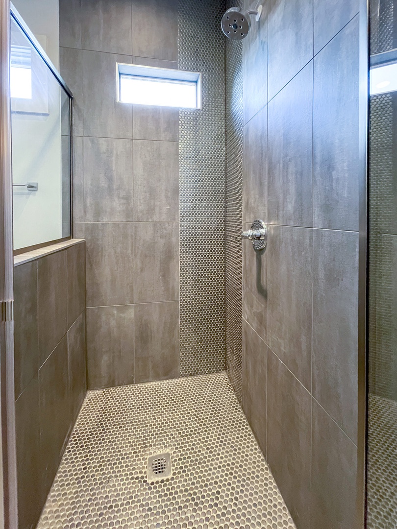 Unit B- En suite bathroom with dual sinks and standing shower