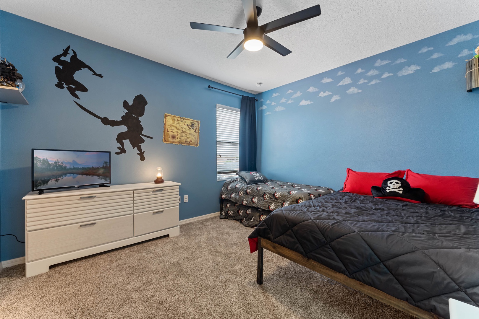 Bedroom 4 Peter Pan themed with Queen bed, Twin bed, Twin trundle, Smart TV, and shared Jack & Jill style en-suite (2nd floor)