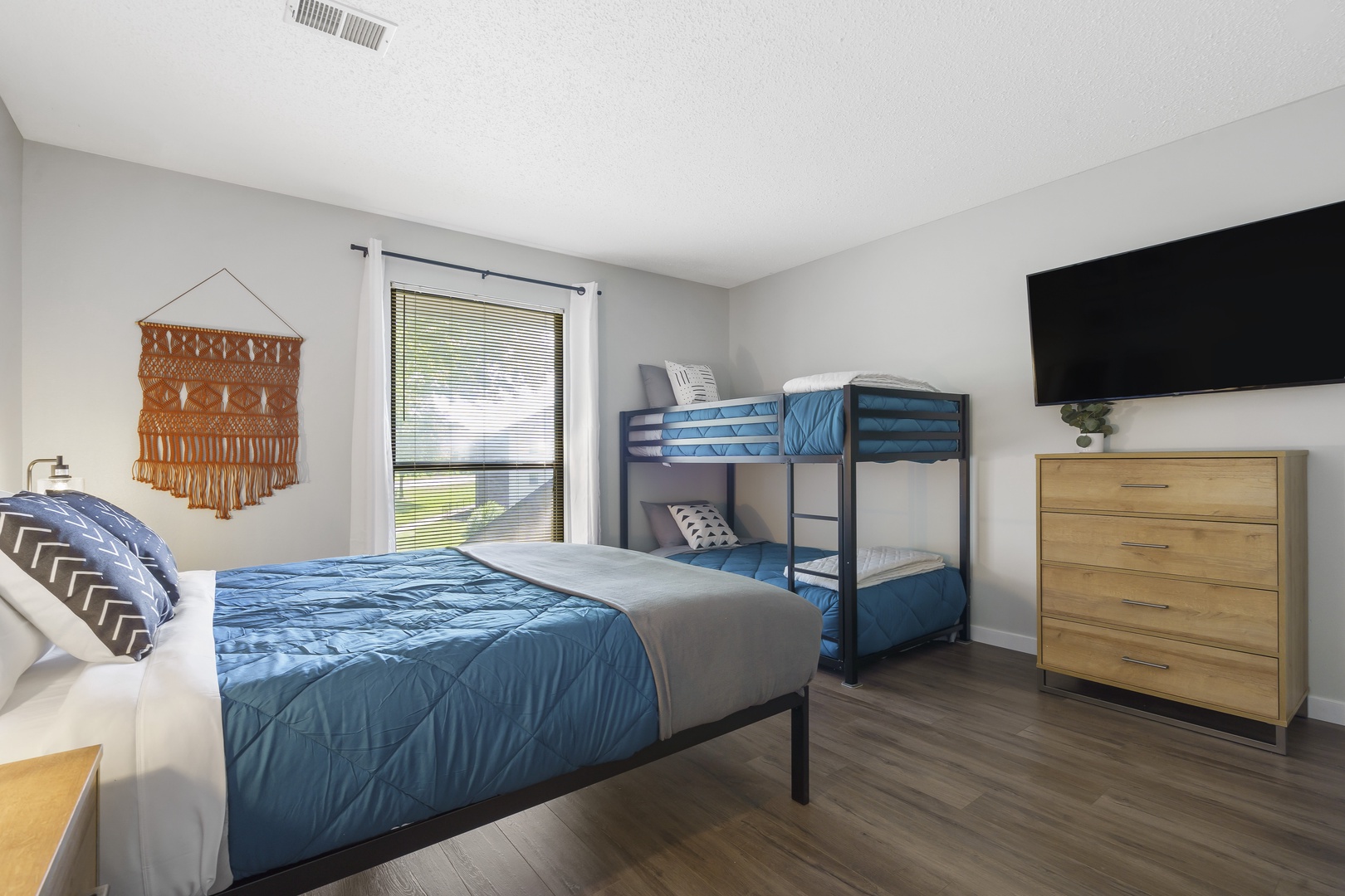 Bedroom 1 is equipped with queen bed & bunk beds