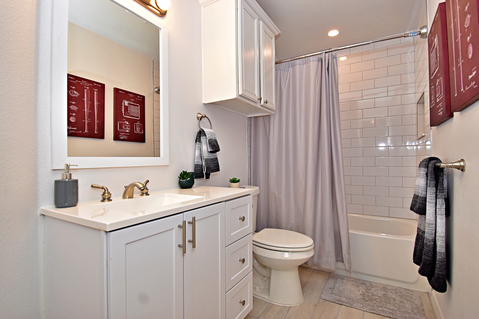 This 2nd floor full bath offers a sleek single vanity & shower/tub combo