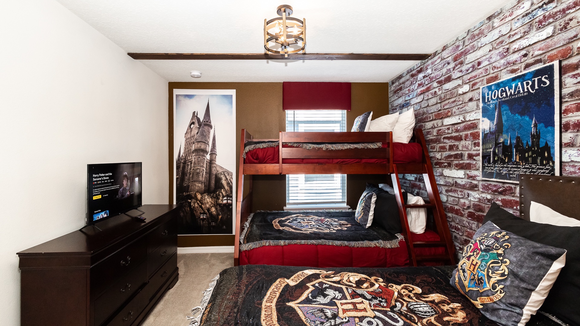 This 2nd floor bedroom offers twin-over-full bunks & a standalone twin bed