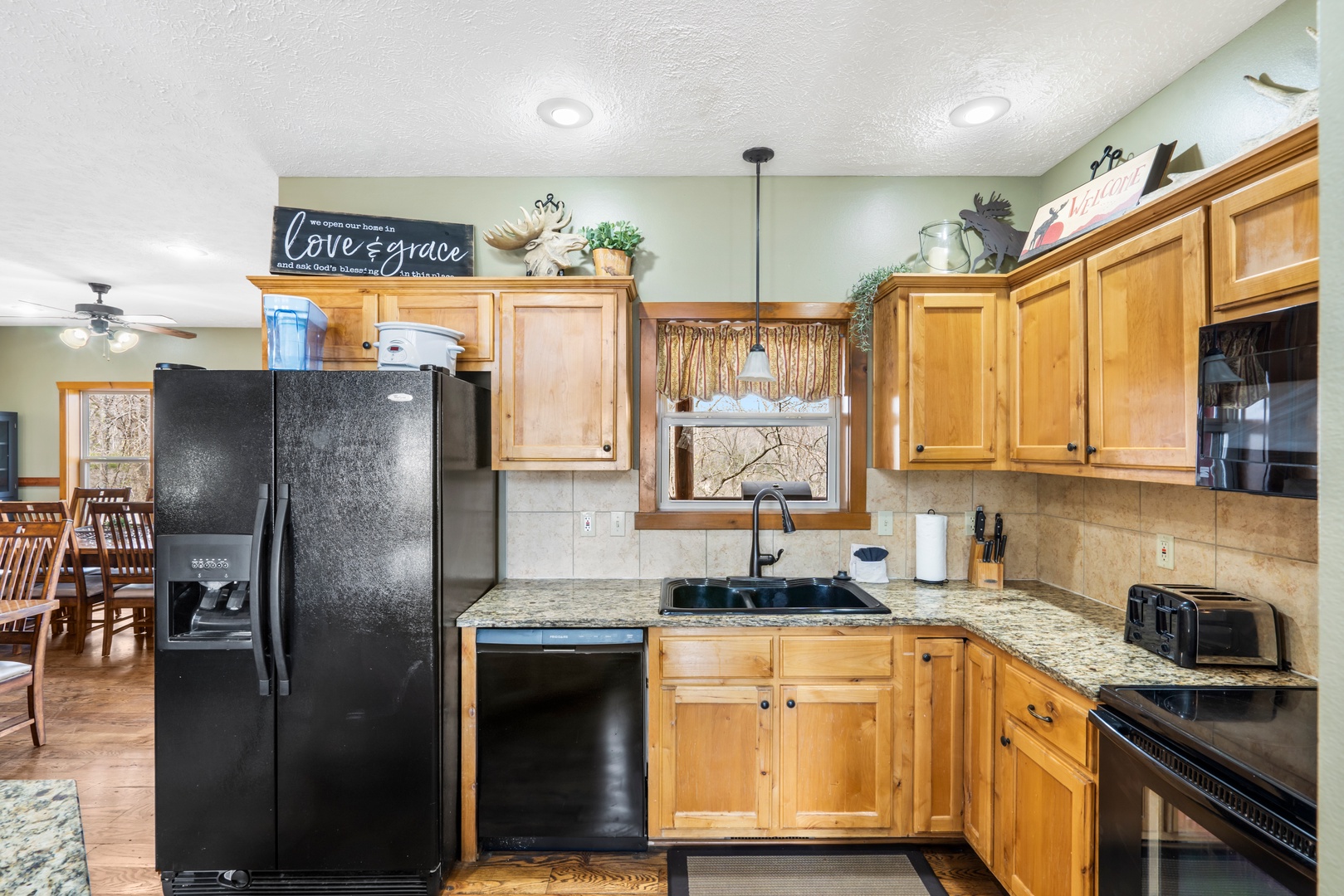 The open, inviting kitchen offers ample space & all the comforts of home