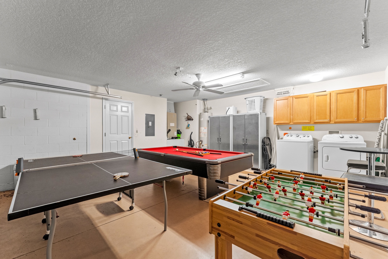 Game room with pool, ping pong, and foosball tables, plus a café table for 2