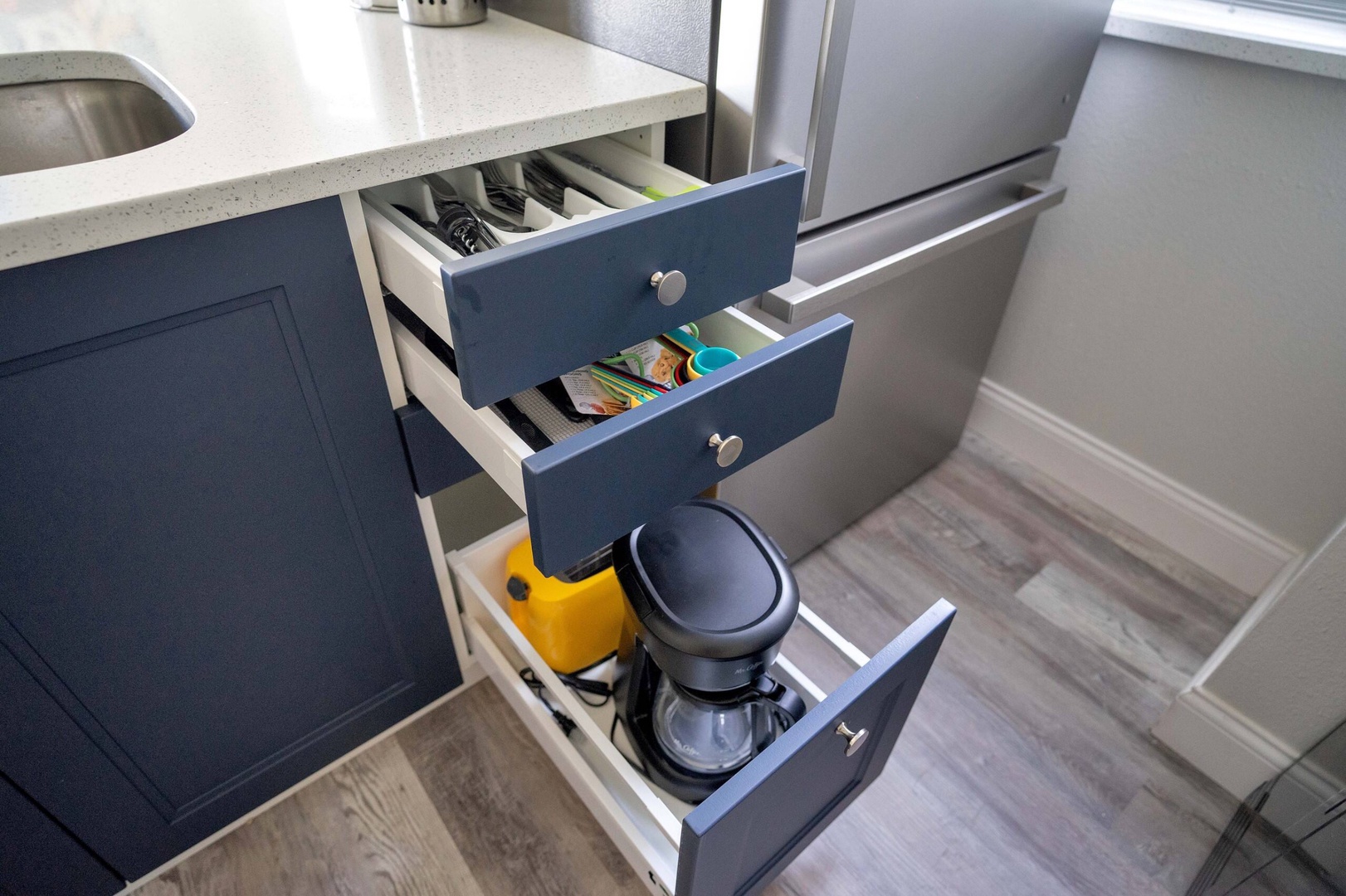 The open, airy kitchen offers ample space & all the comforts of home