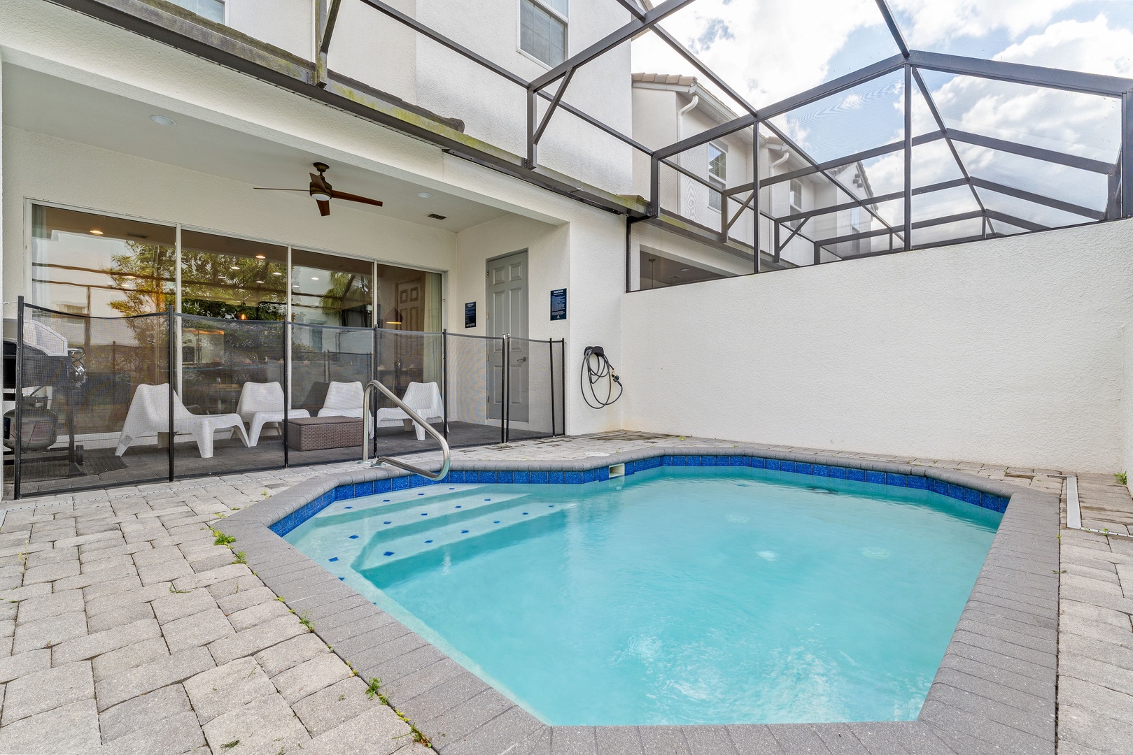 Private screened in pool with outdoor seating