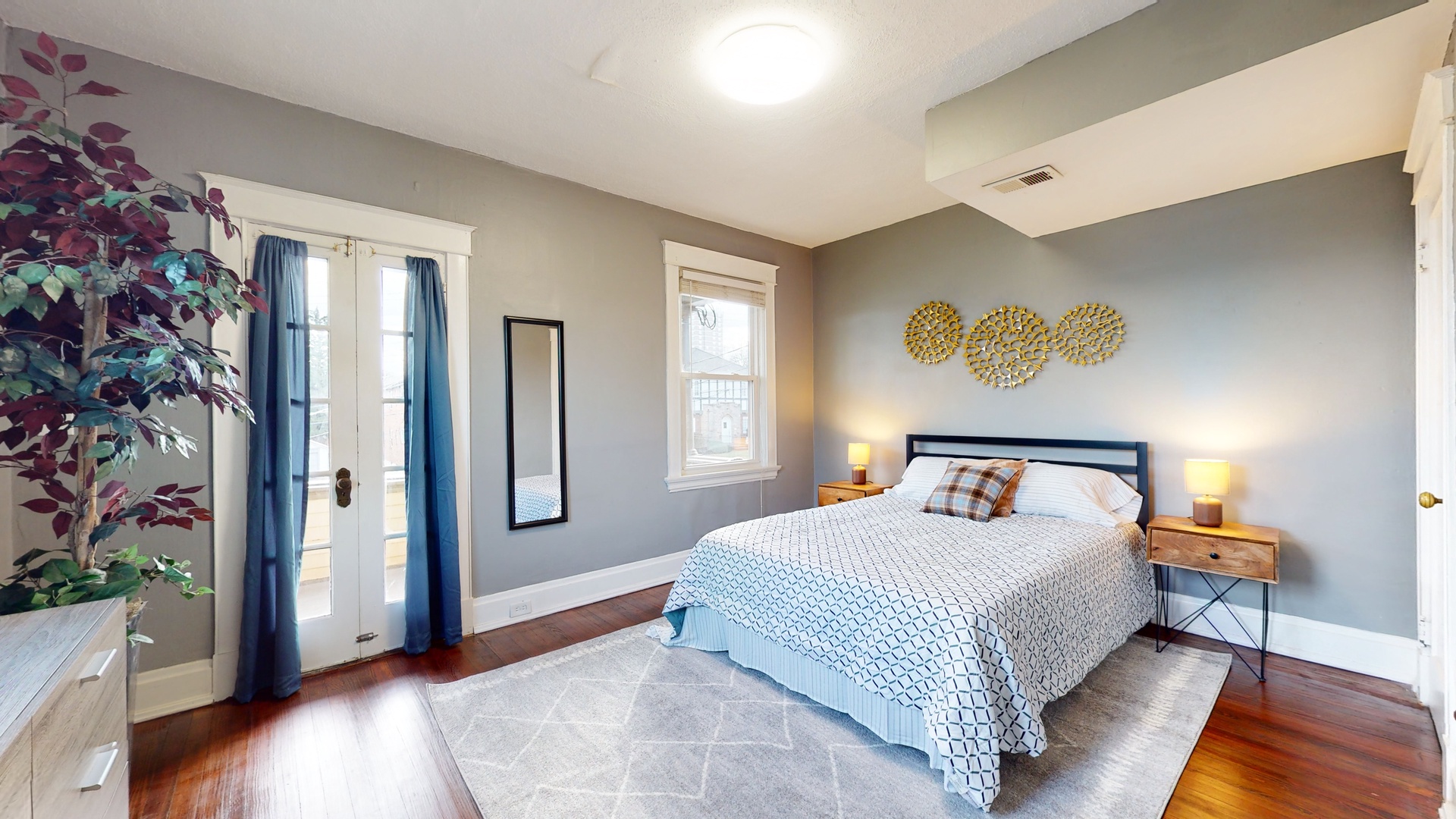 Cityscape tranquility awaits in the master bedroom, with a chic queen bed & private balcony