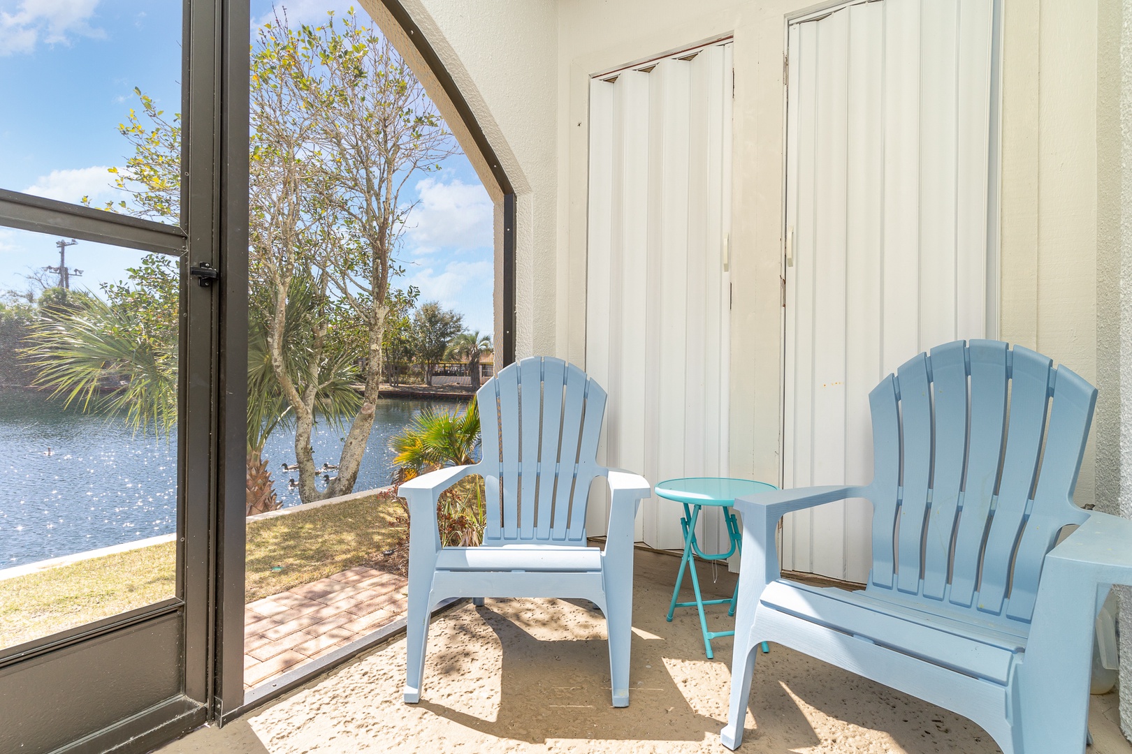 Lounge the day away with serene water views on the screened patio