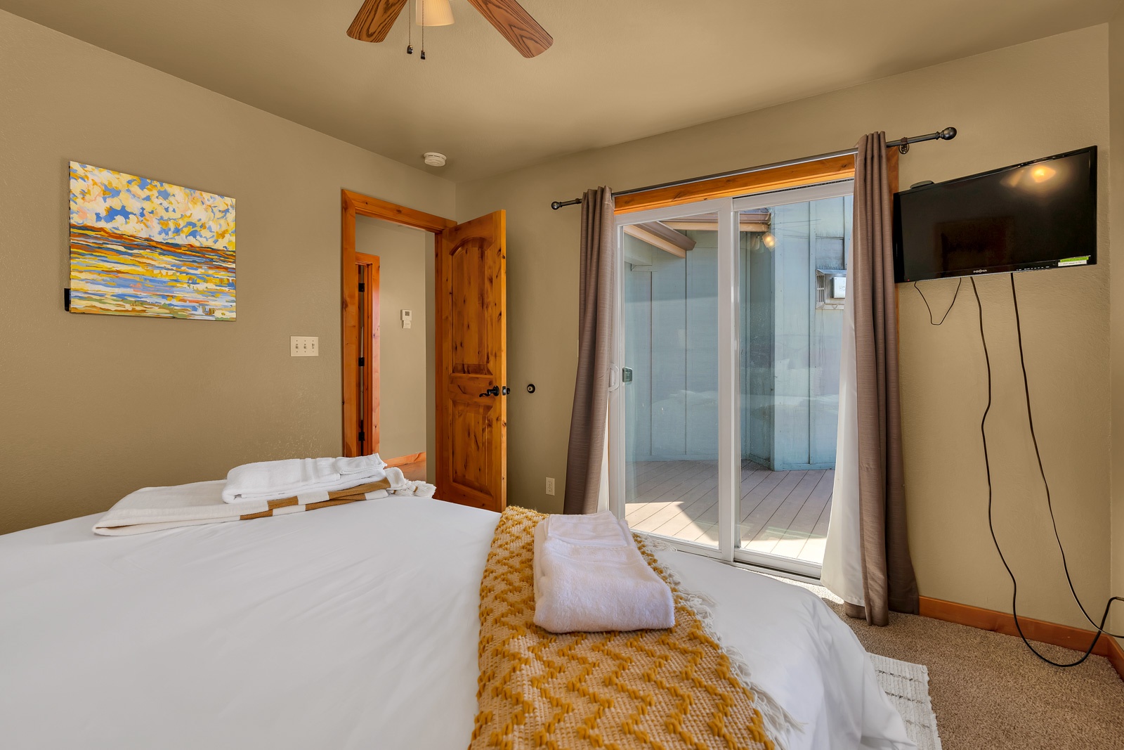 An additional king bedroom on the main level offers a Smart TV & deck access