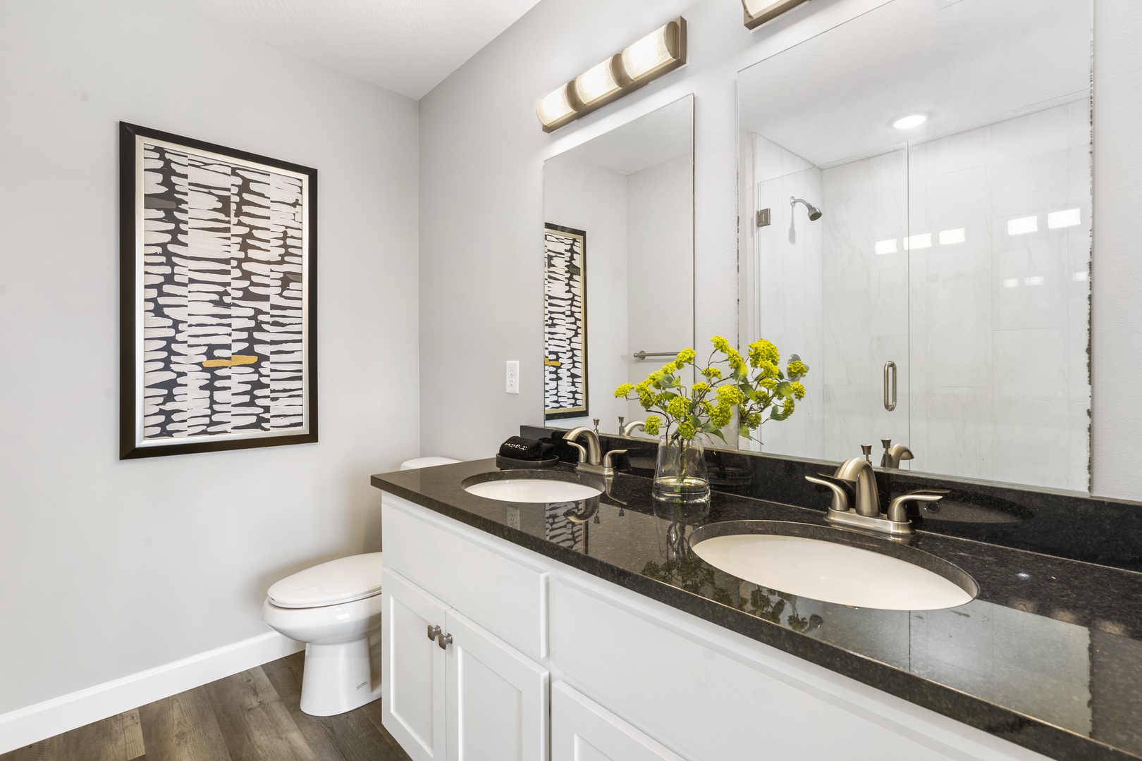 A double vanity & shower await in this large ensuite bath