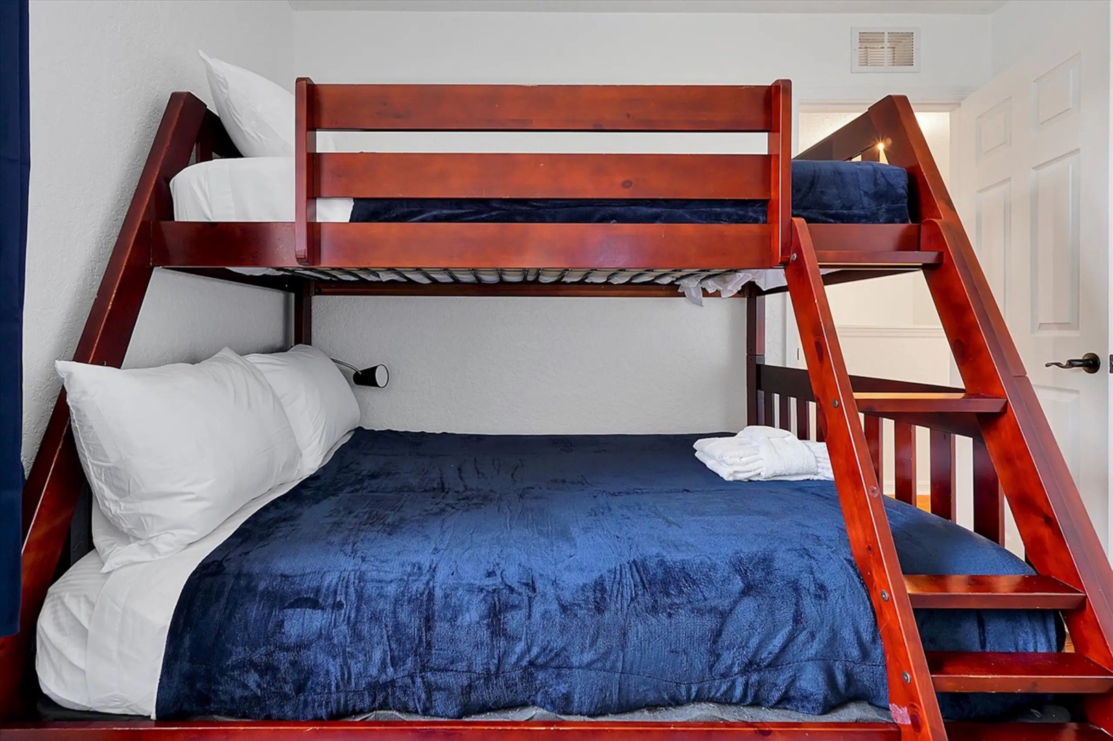 The 3rd bedroom features twin-over full bunks, a twin trundle, & smart TV