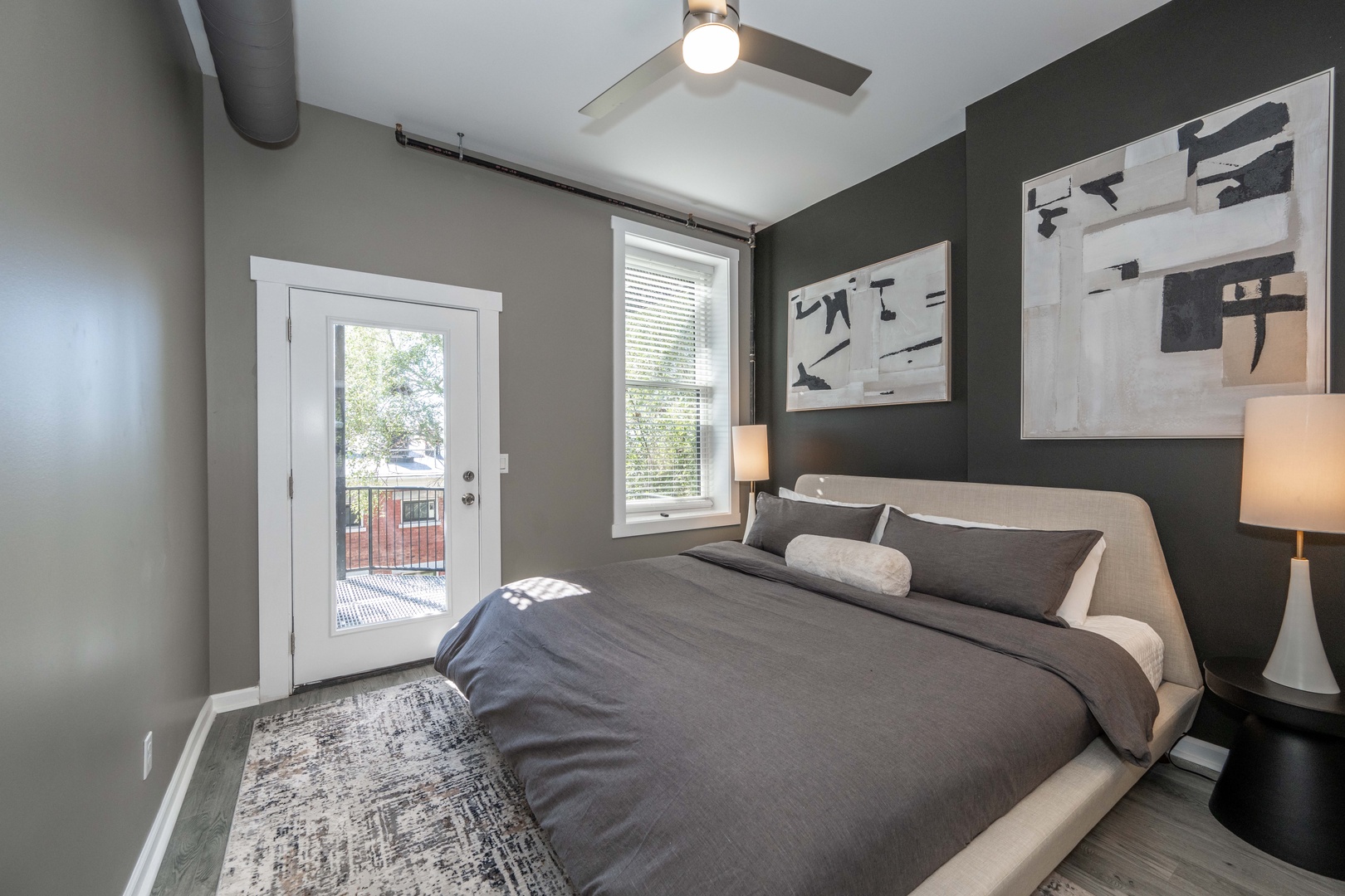 This unit’s cozy king bedroom includes balcony & laundry access