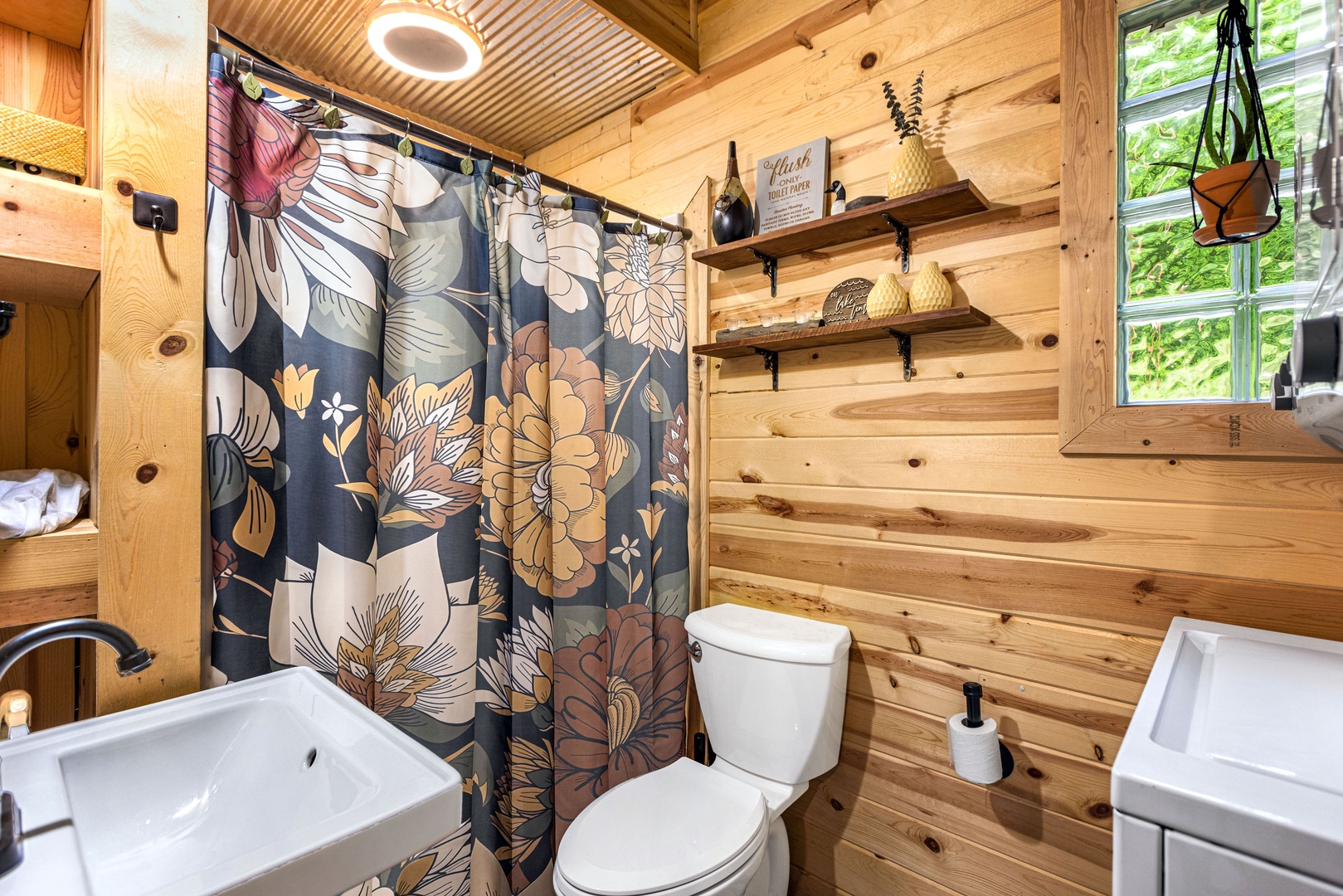 Bathroom with stand-up shower and stackable washer and dryer