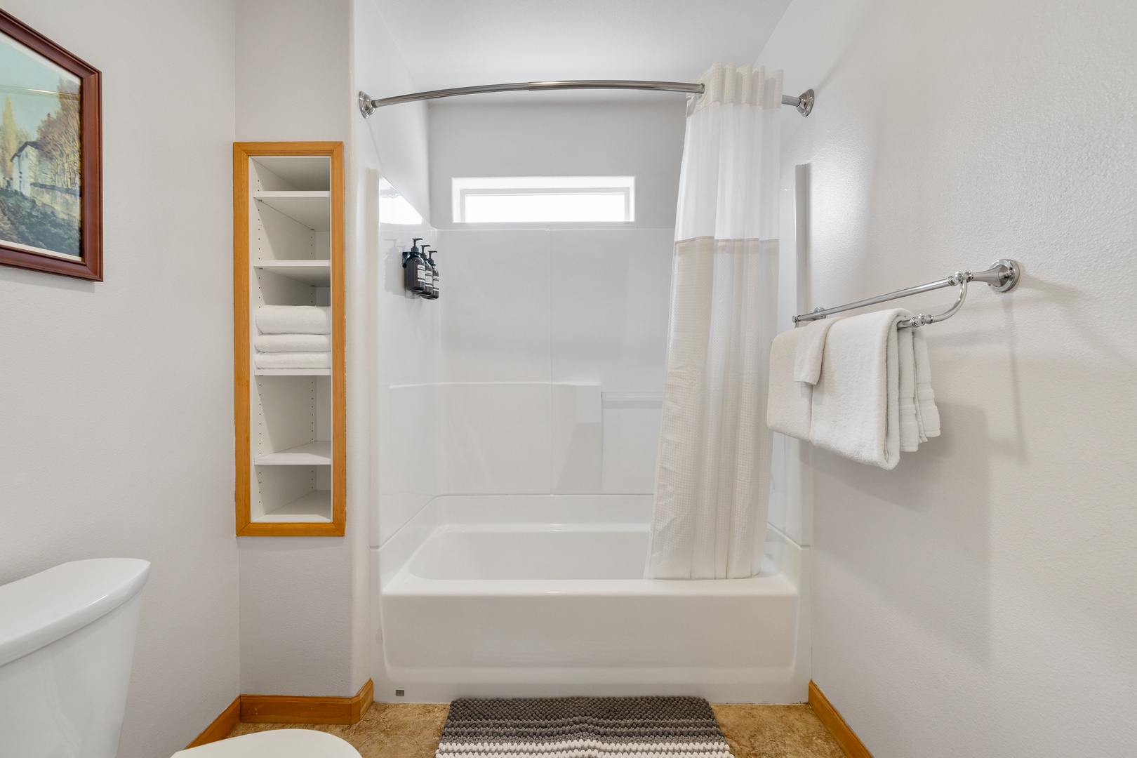 The king en suite includes an oversized single vanity & shower/tub combo
