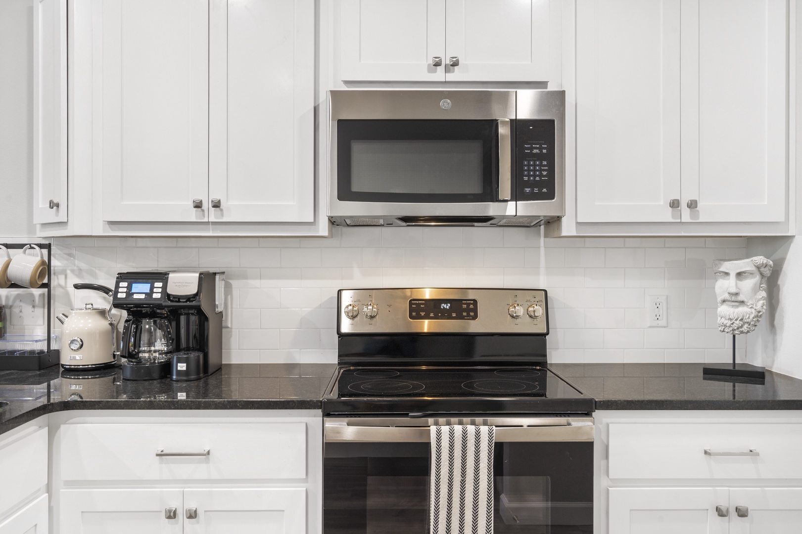 The open, airy kitchen offers ample space & all the comforts of home