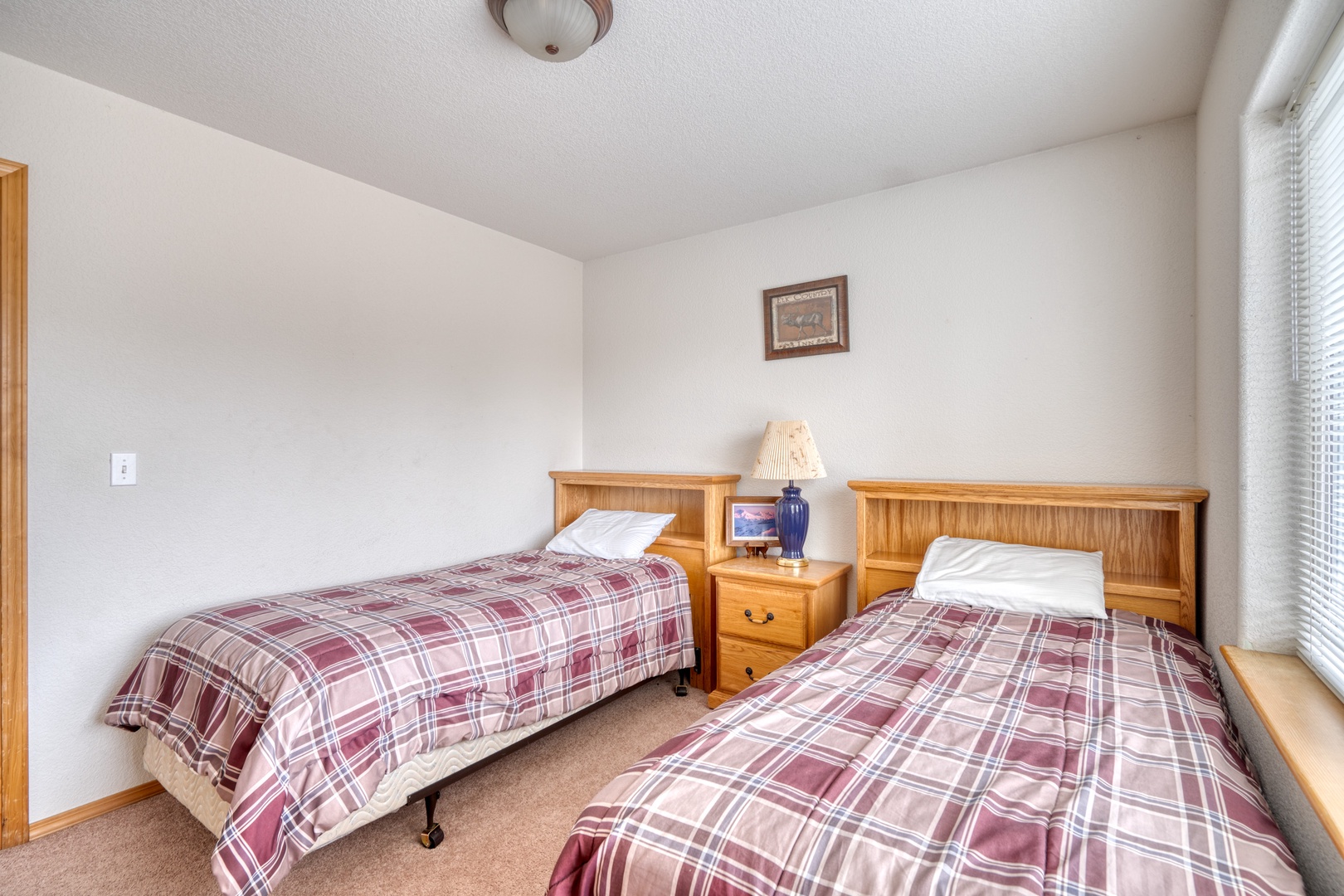 A pair of plush twin beds awaits in this second-floor bedroom