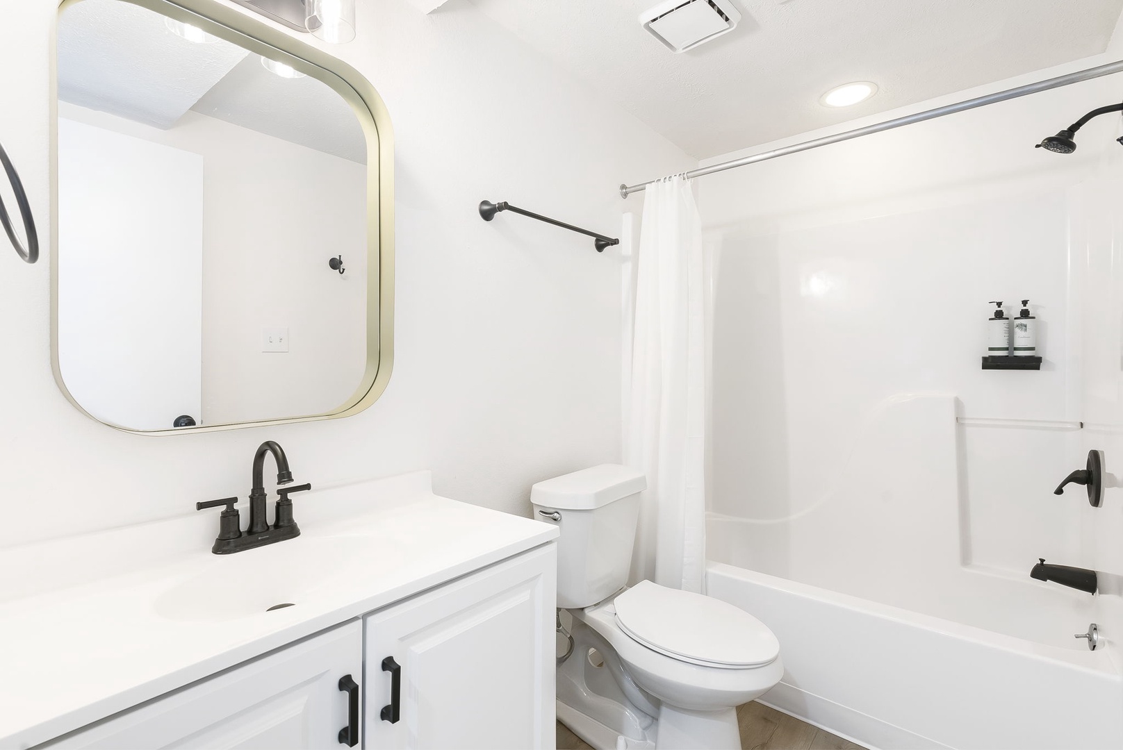 This 1st floor full bath includes a single vanity & shower/tub combo