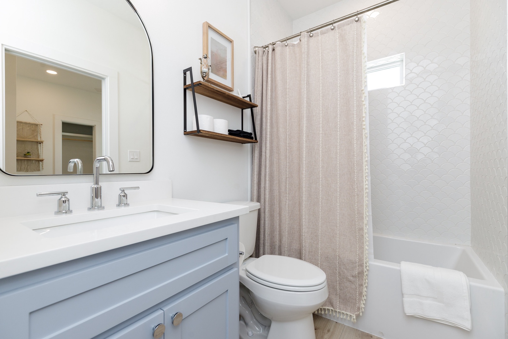 The queen en suite includes a single vanity & shower/tub combo