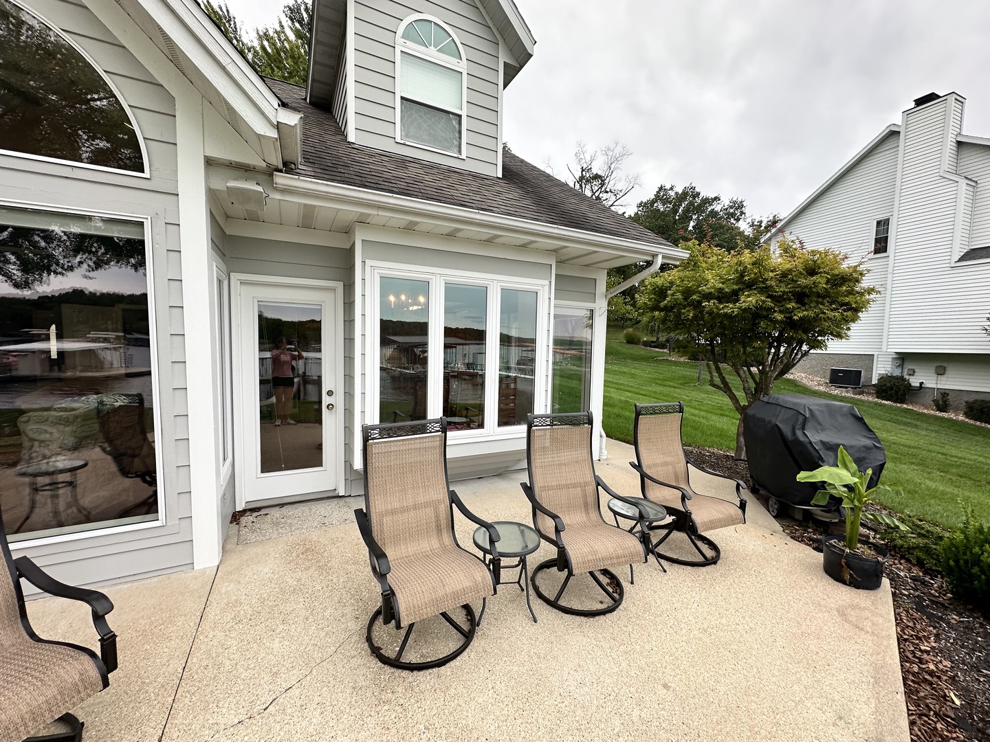 Patio with outdoor seating grill, and lake view