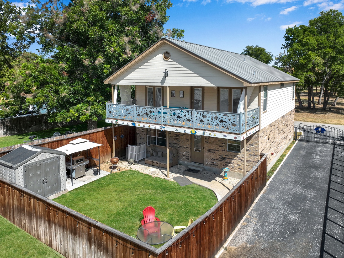 The whole family will love relaxing, dining, & playing in the fenced back yard