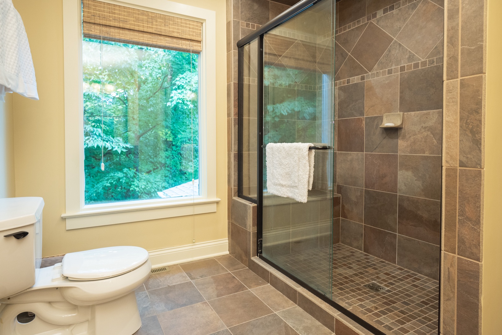 The 2nd floor king en suite offers a single vanity & luxurious glass shower