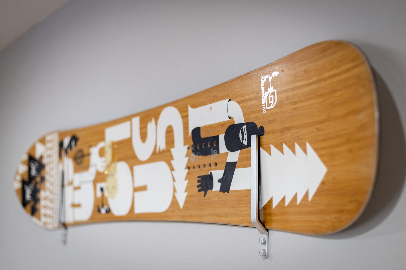 Snowboard on game room wall as decor