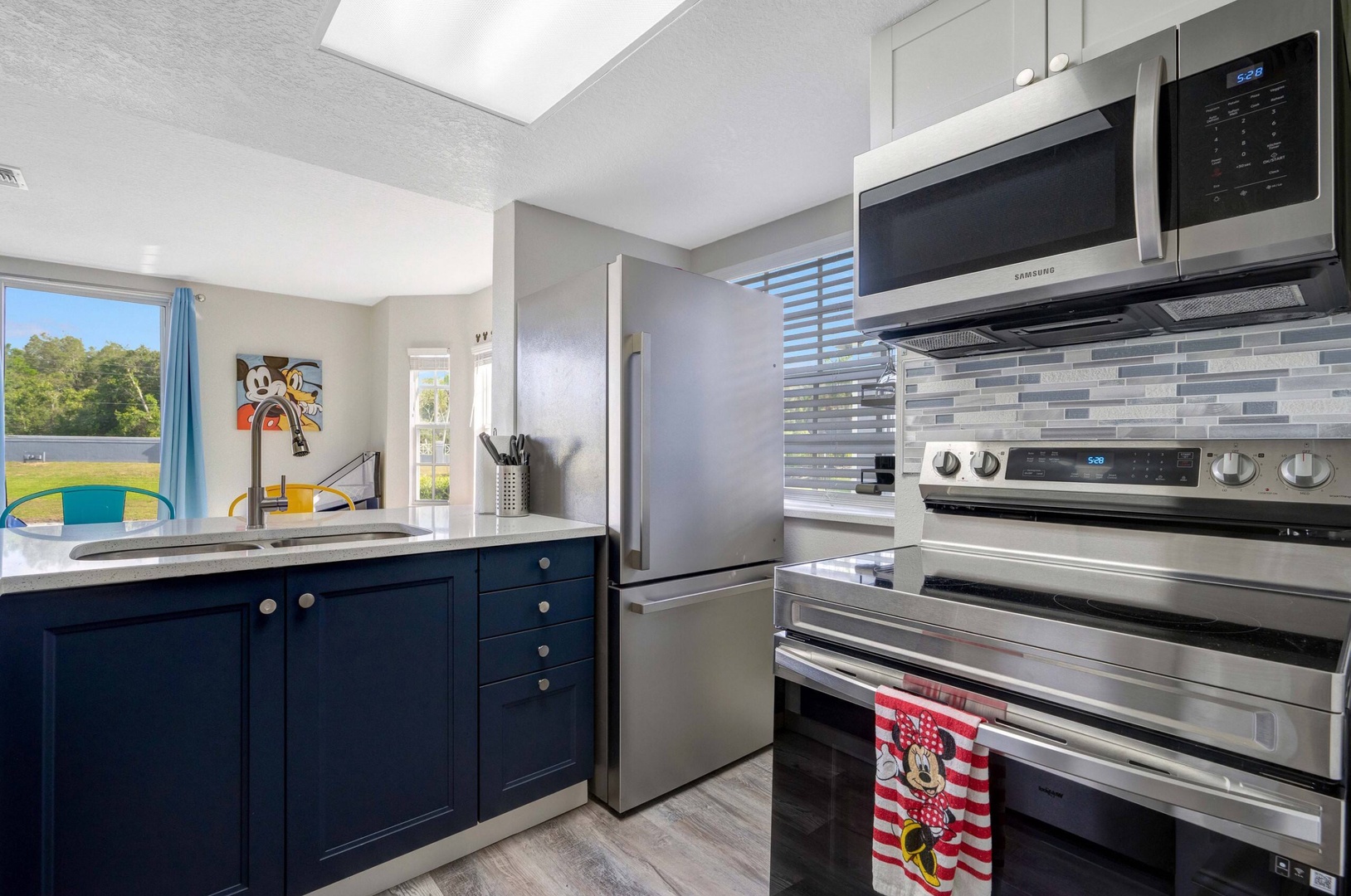 The open, airy kitchen offers ample space & all the comforts of home