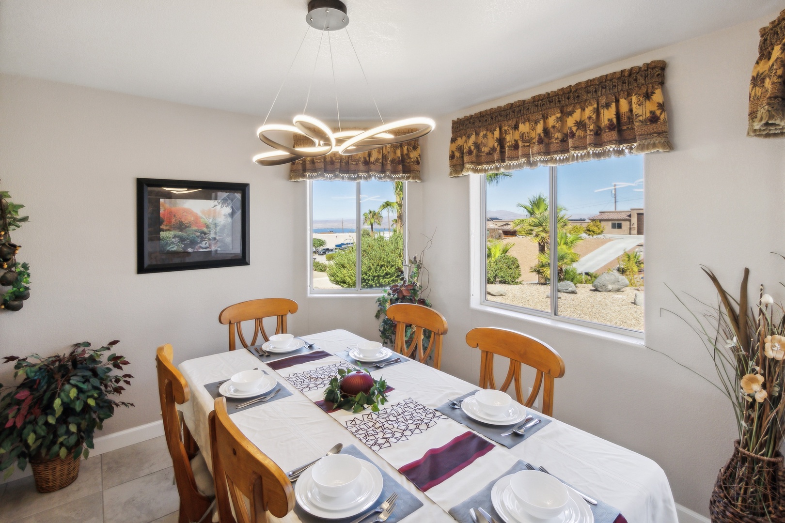 Gather for meals with a lake view at the dining table, seating 6