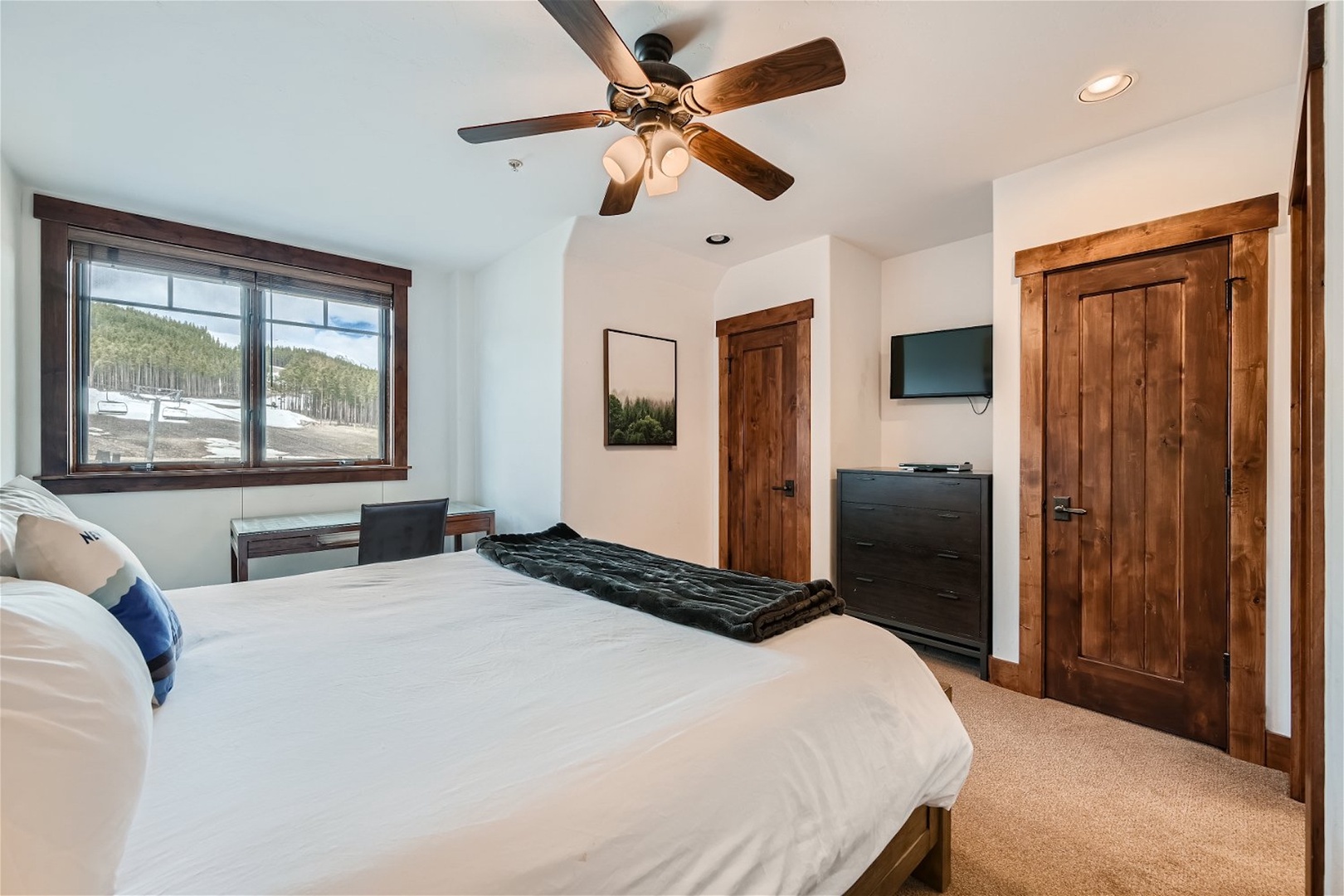 The second suite boasts a plush king bed, Smart TV, & private ensuite