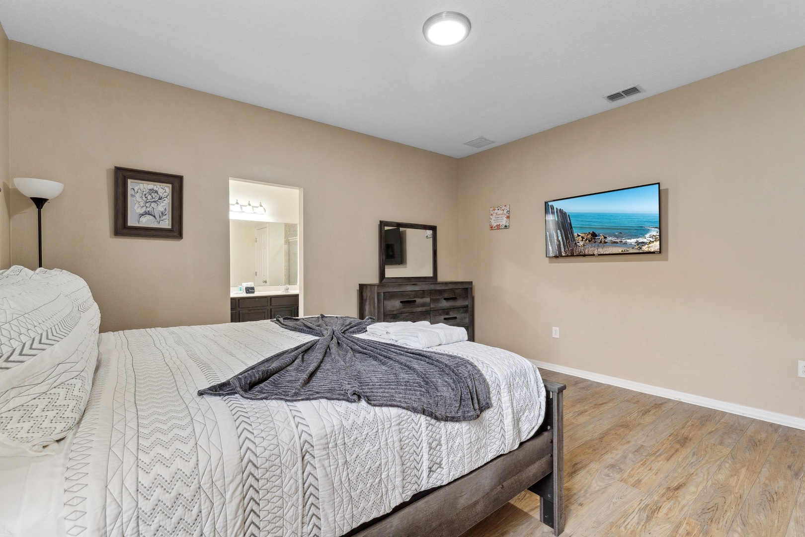 Bedroom 1 with king bed, Smart TV, and ensuite