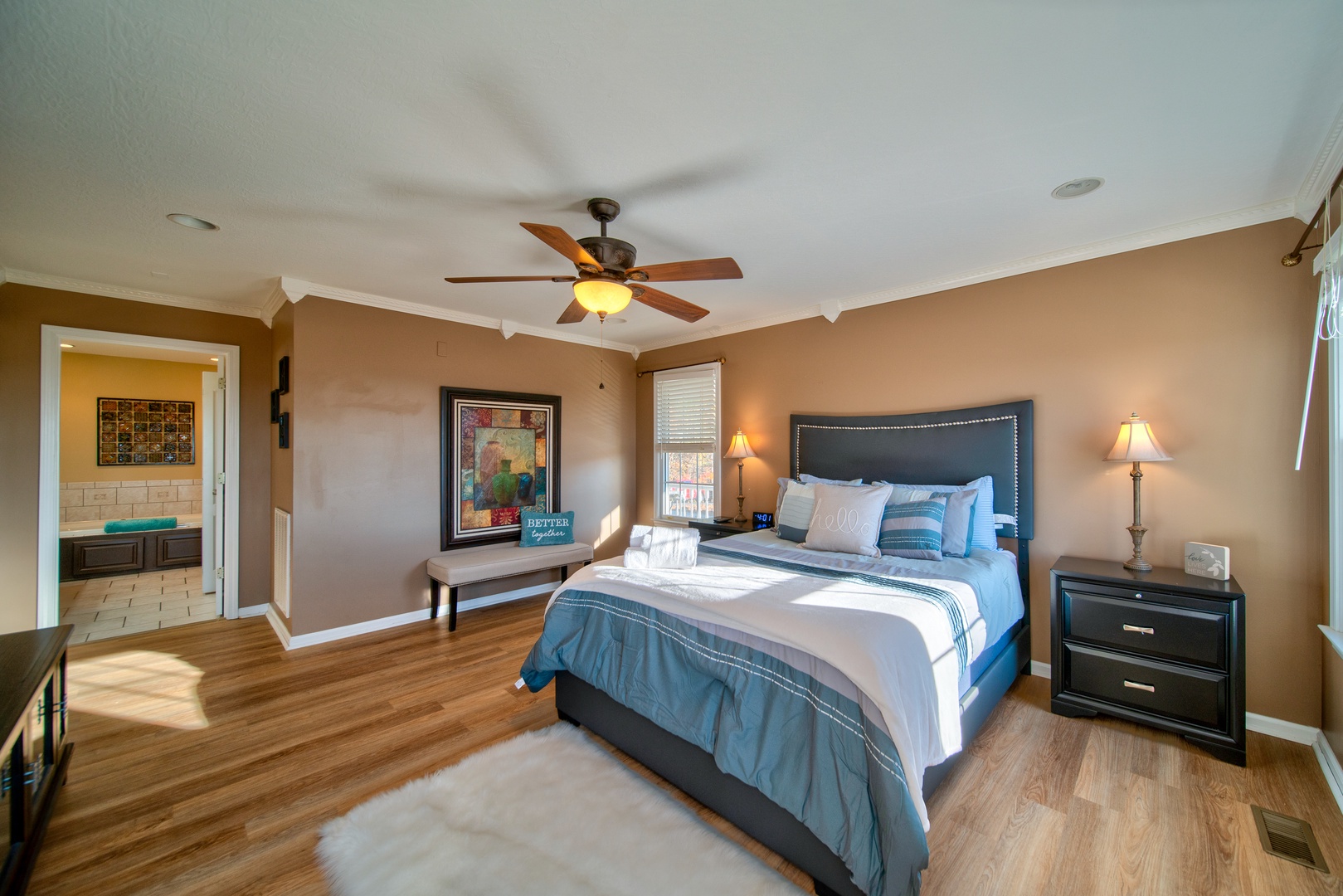 The 1st floor master suite boasts mountain views & a private ensuite bath