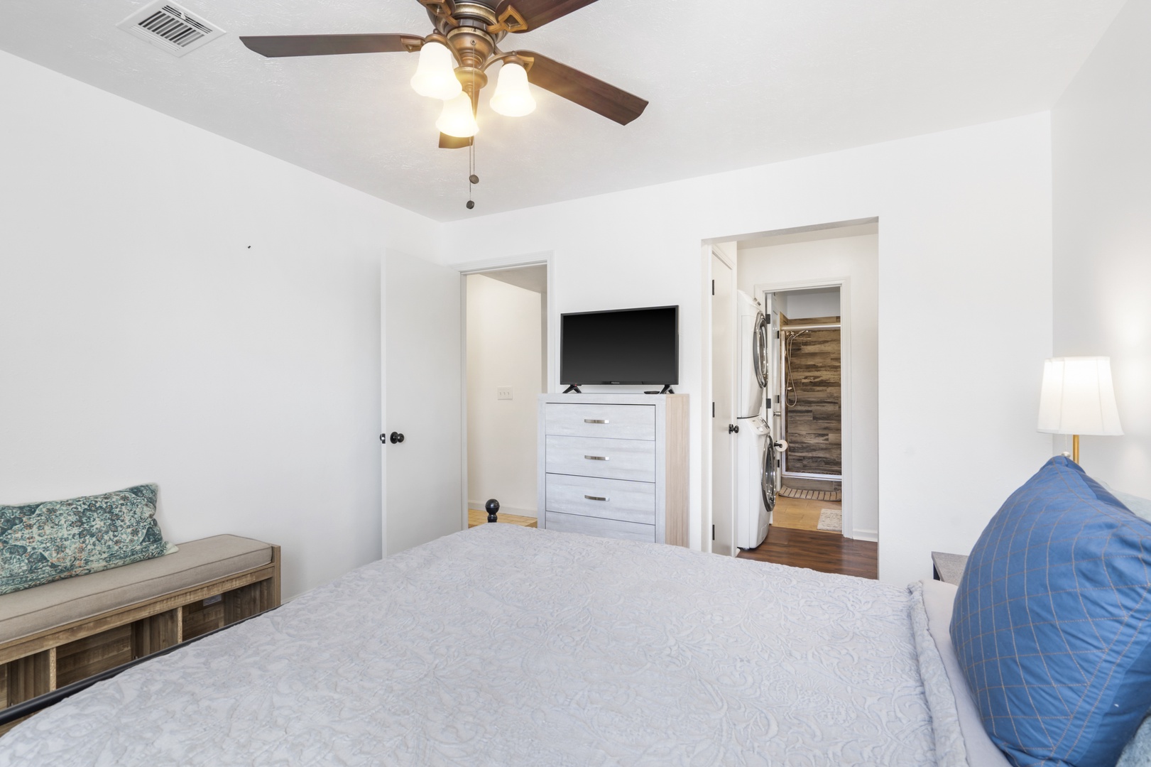 Bedroom with queen bed, Smart TV, and ensuite