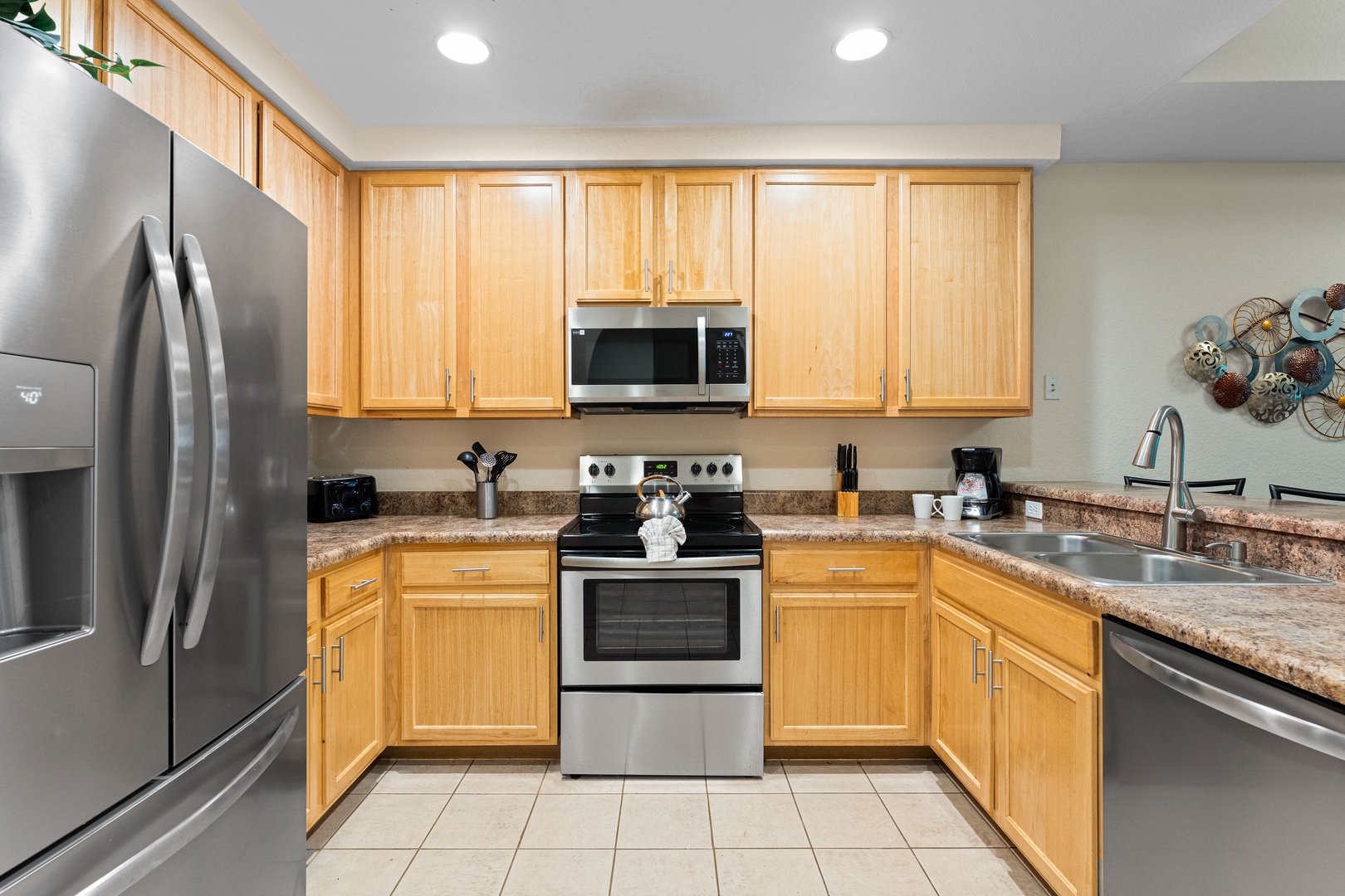 The cozy kitchen offers ample space & all the comforts of home