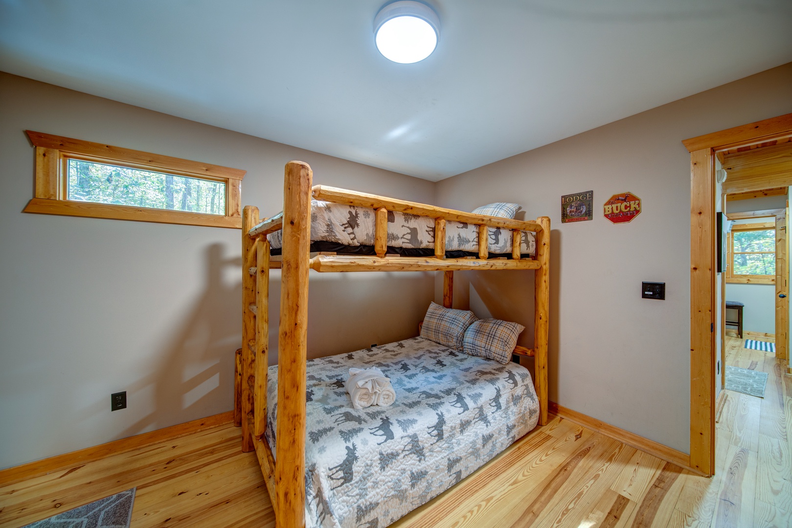 Bedroom W/ twin bunks and screened porch leads to Hot Tub