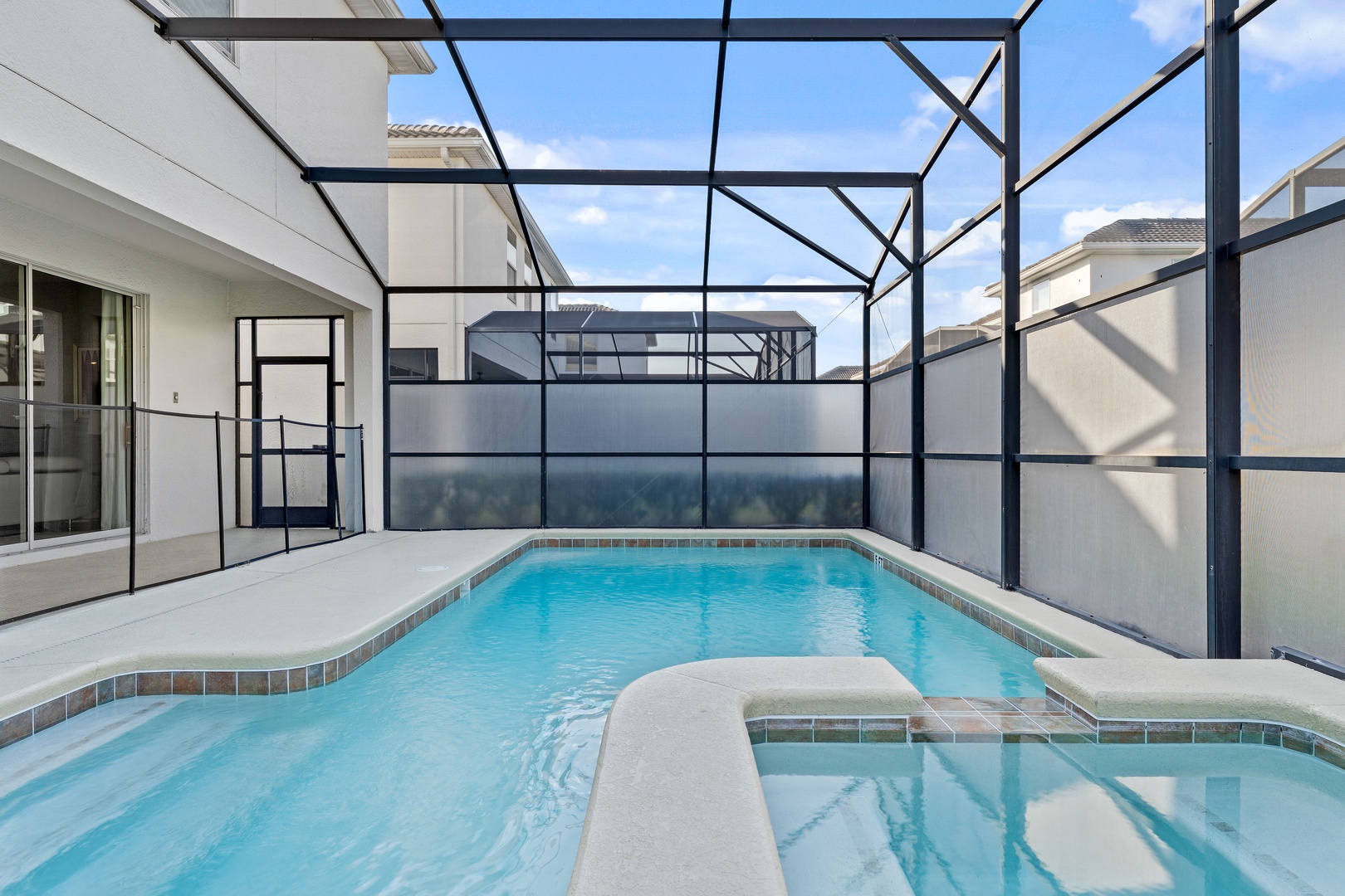 Screened in pool with outdoor seating