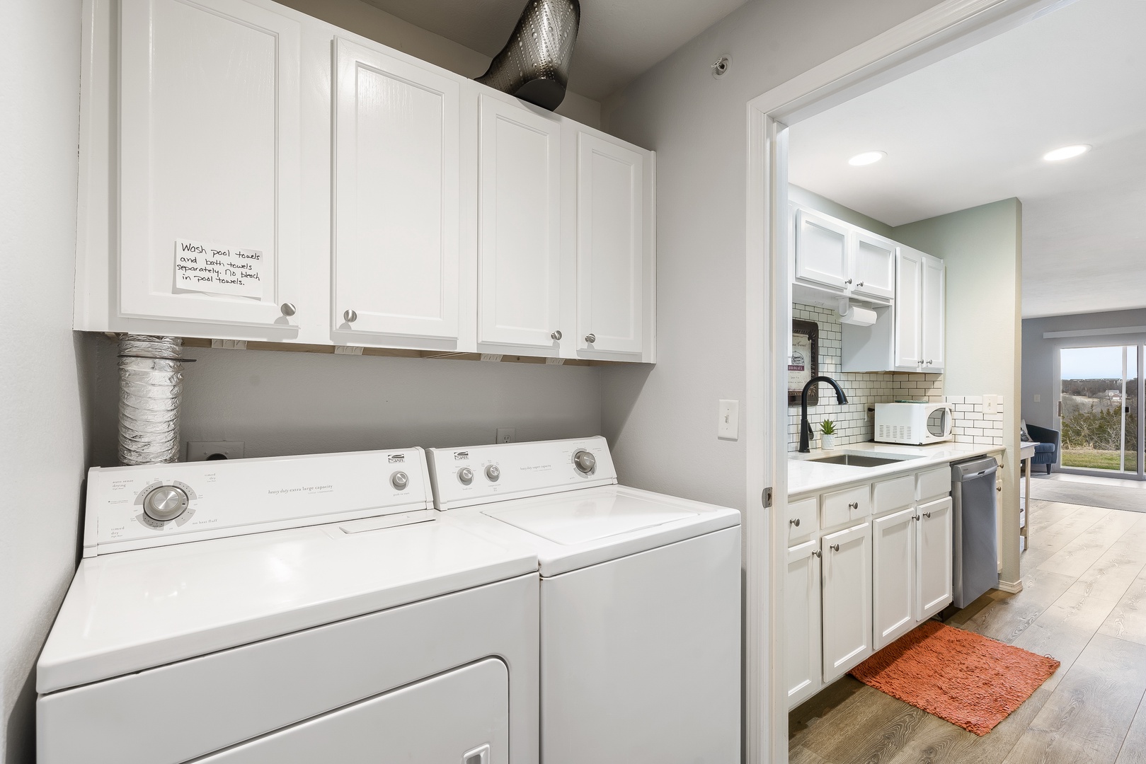 Private laundry facilities are tucked away behind the kitchen