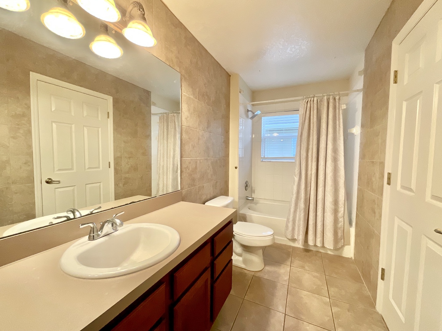 The shared 2nd floor full bath includes a single vanity & shower/tub combo