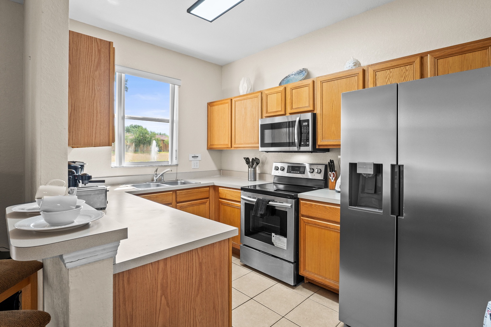 The kitchen offers ample storage space & all the comforts of home