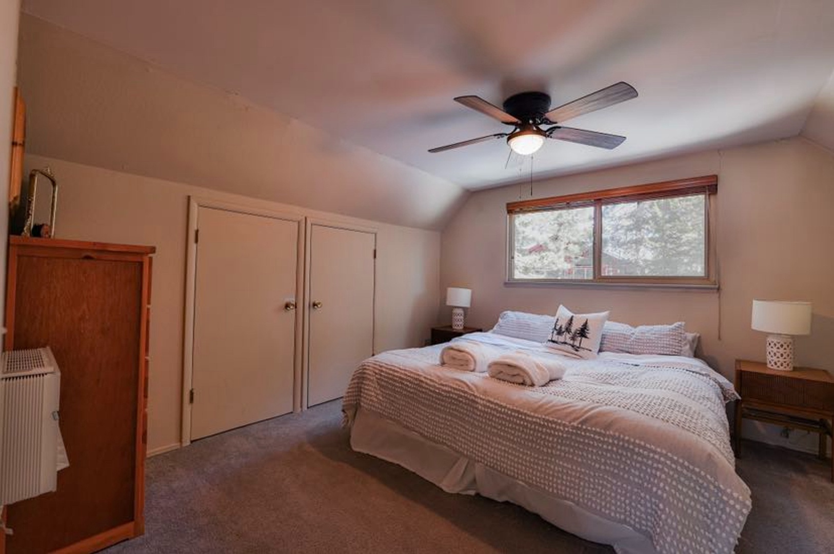 Recharge in the second bedroom retreat, featuring a king bed