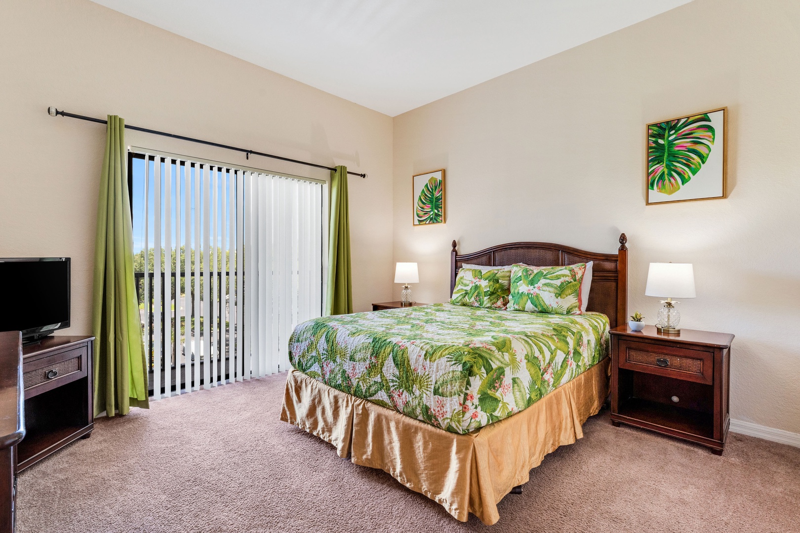 Bedroom 2 with queen bed, TV, balcony, and ensuite